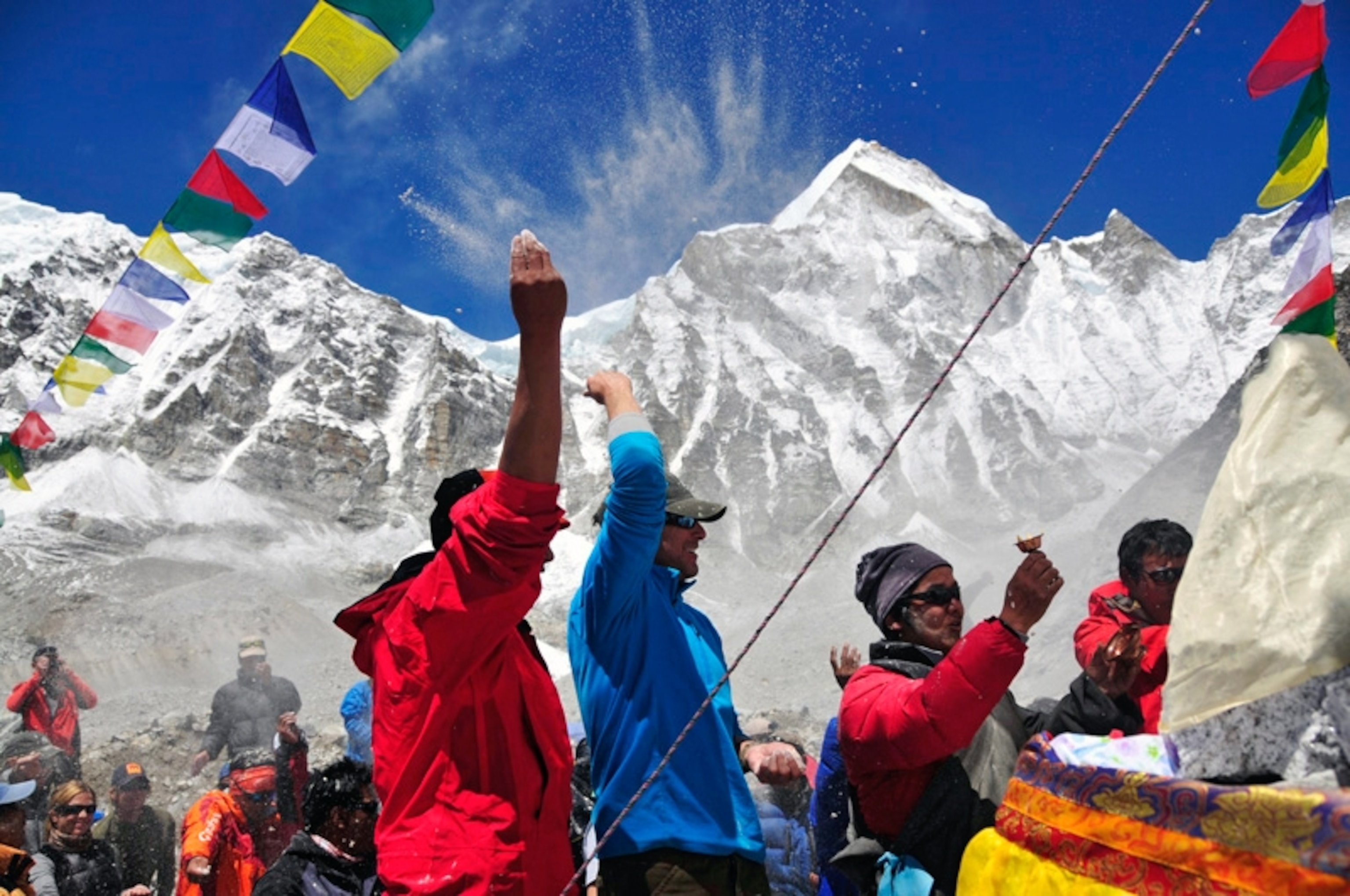 Peter Whittaker throws tsampa buckwheat flour lama's puja ceremony expedition