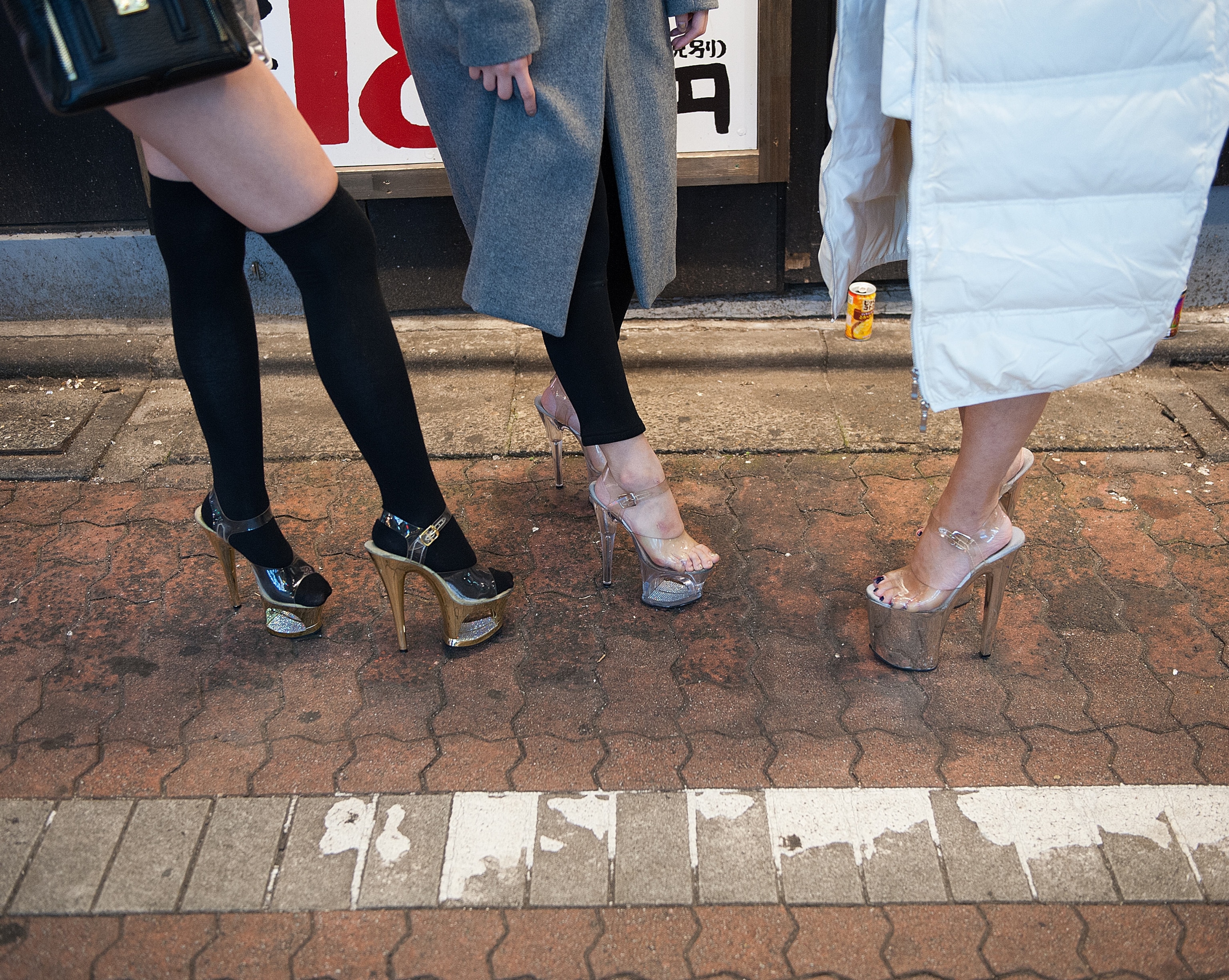 prostitutes stand outside the love hotel district in Tokyo, Japan
