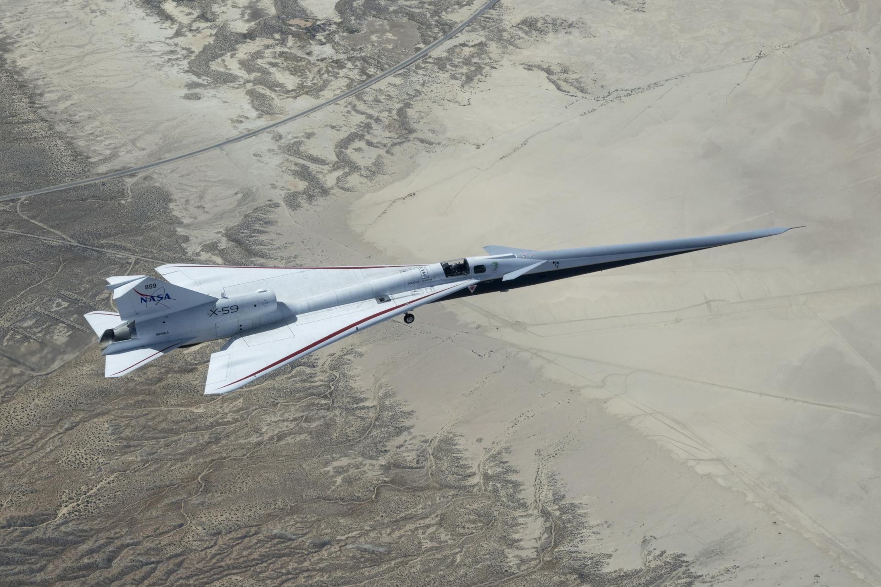 NASA’s X-59 is seen from above over the Mohave Desert.