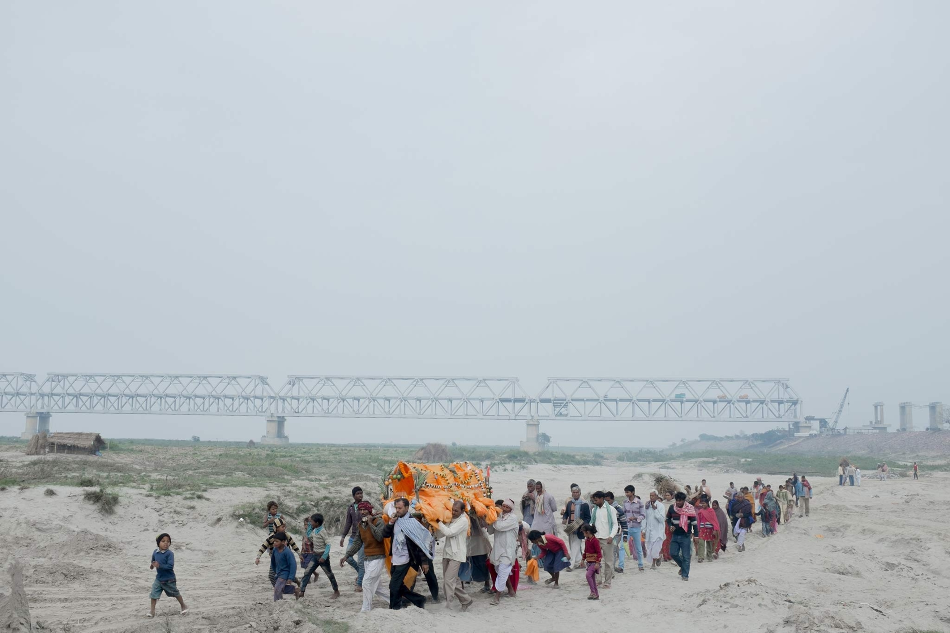 A funeral procession makes its way to the Ganges river in Bihar, India