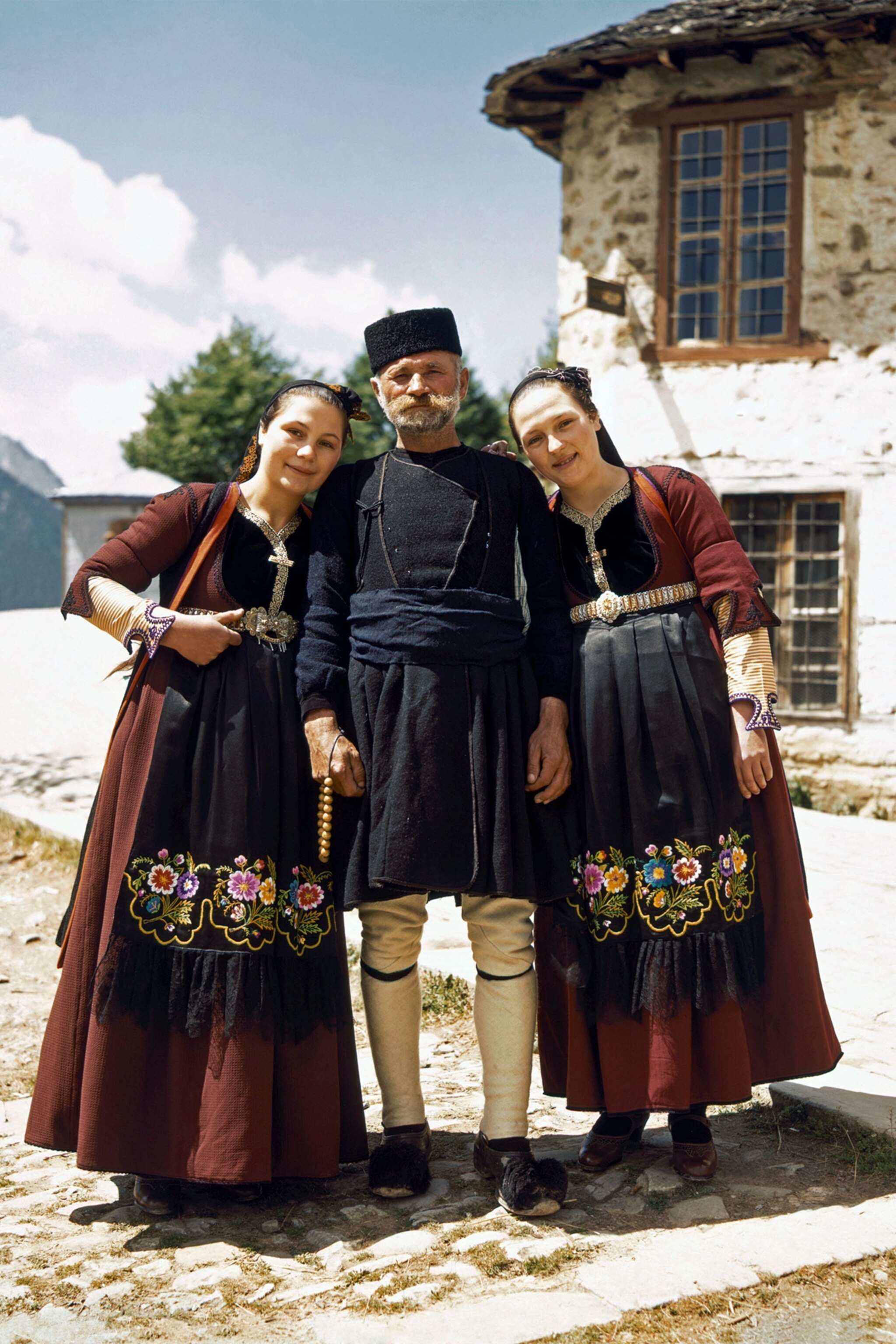 a father and his daughters in Greece