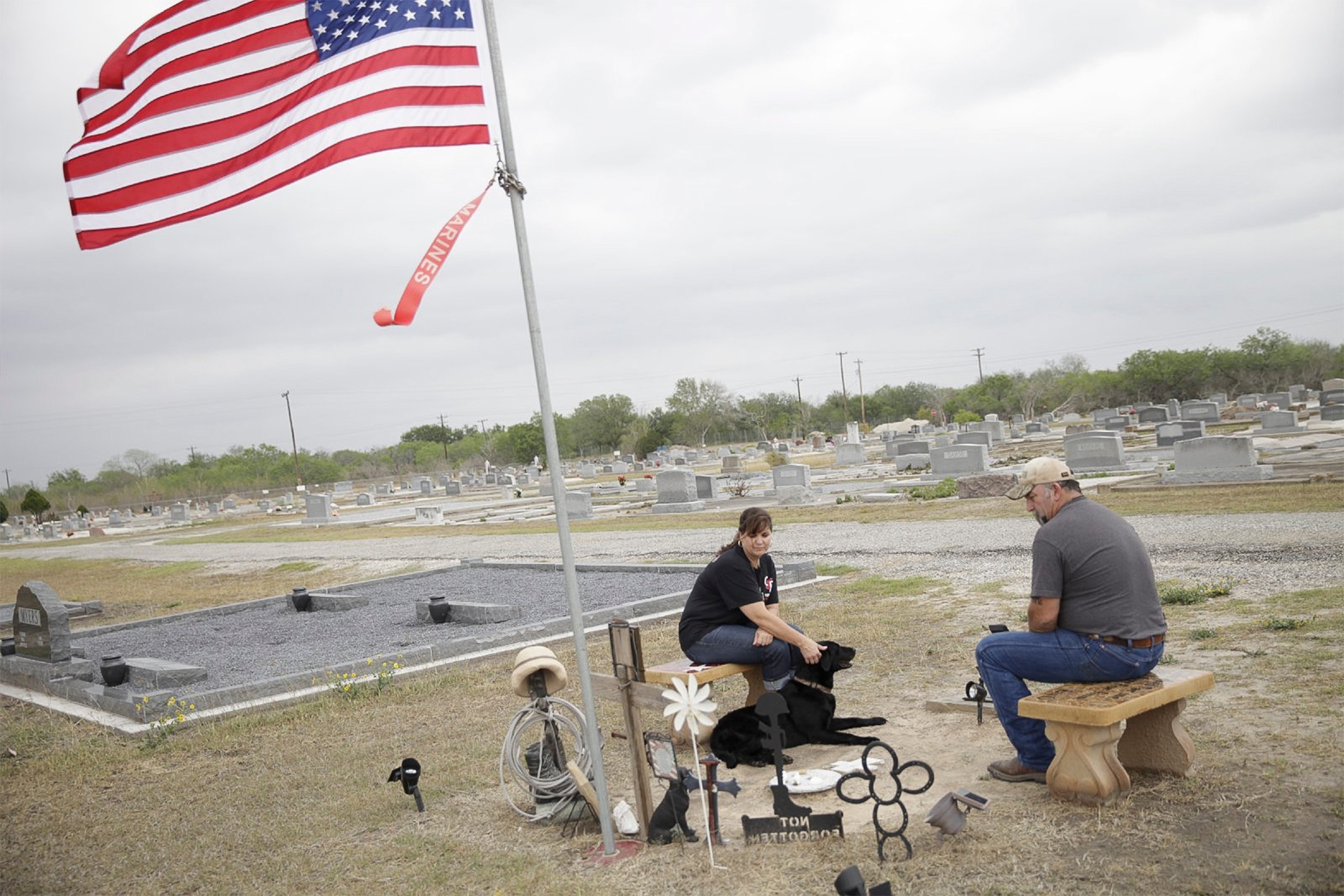 Kathy and Darrell Rusk visiting their son's gravesite.