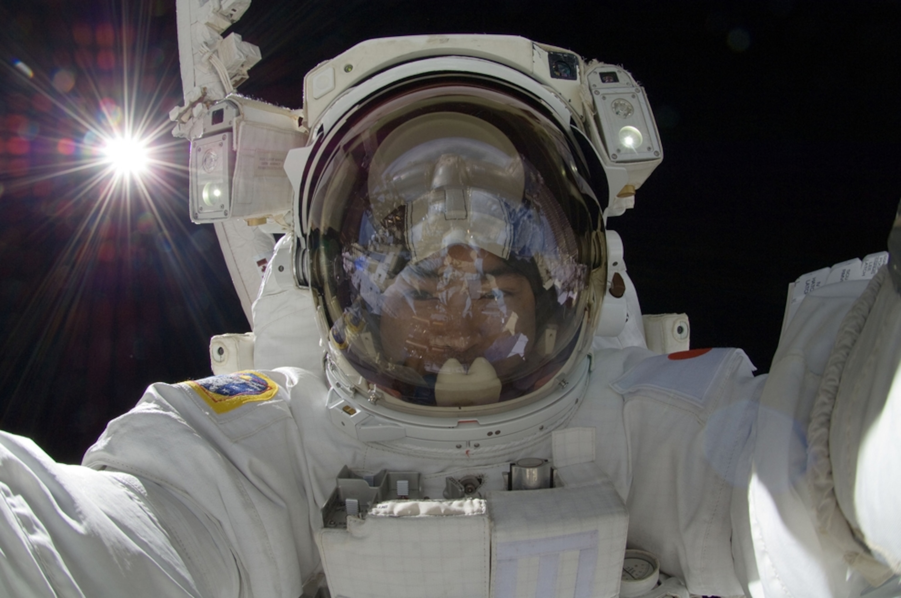 Spacewalk picture - astronaut Aki Hoshide outside International Space Station