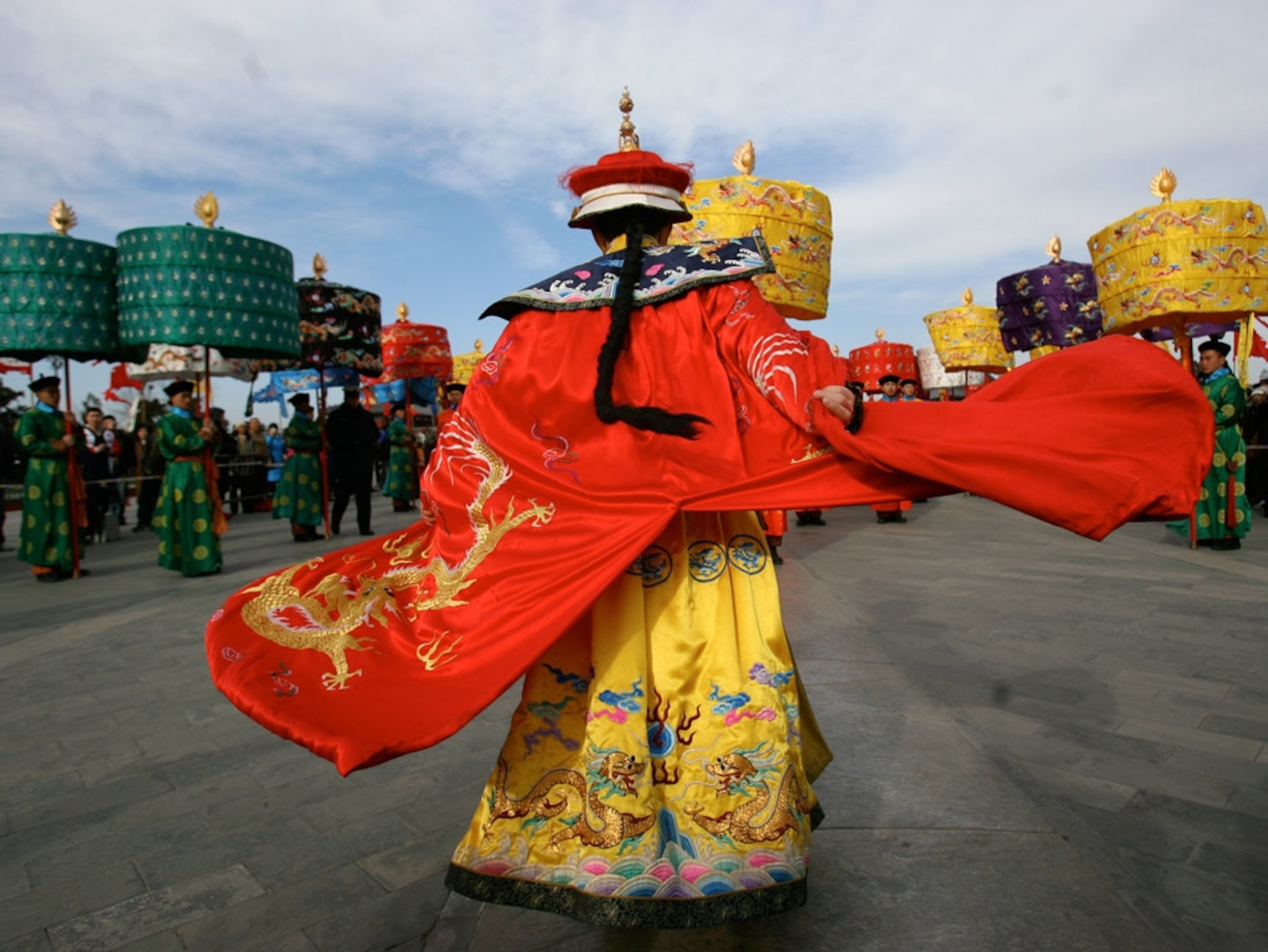 A person walking in an ancient Chinese costume