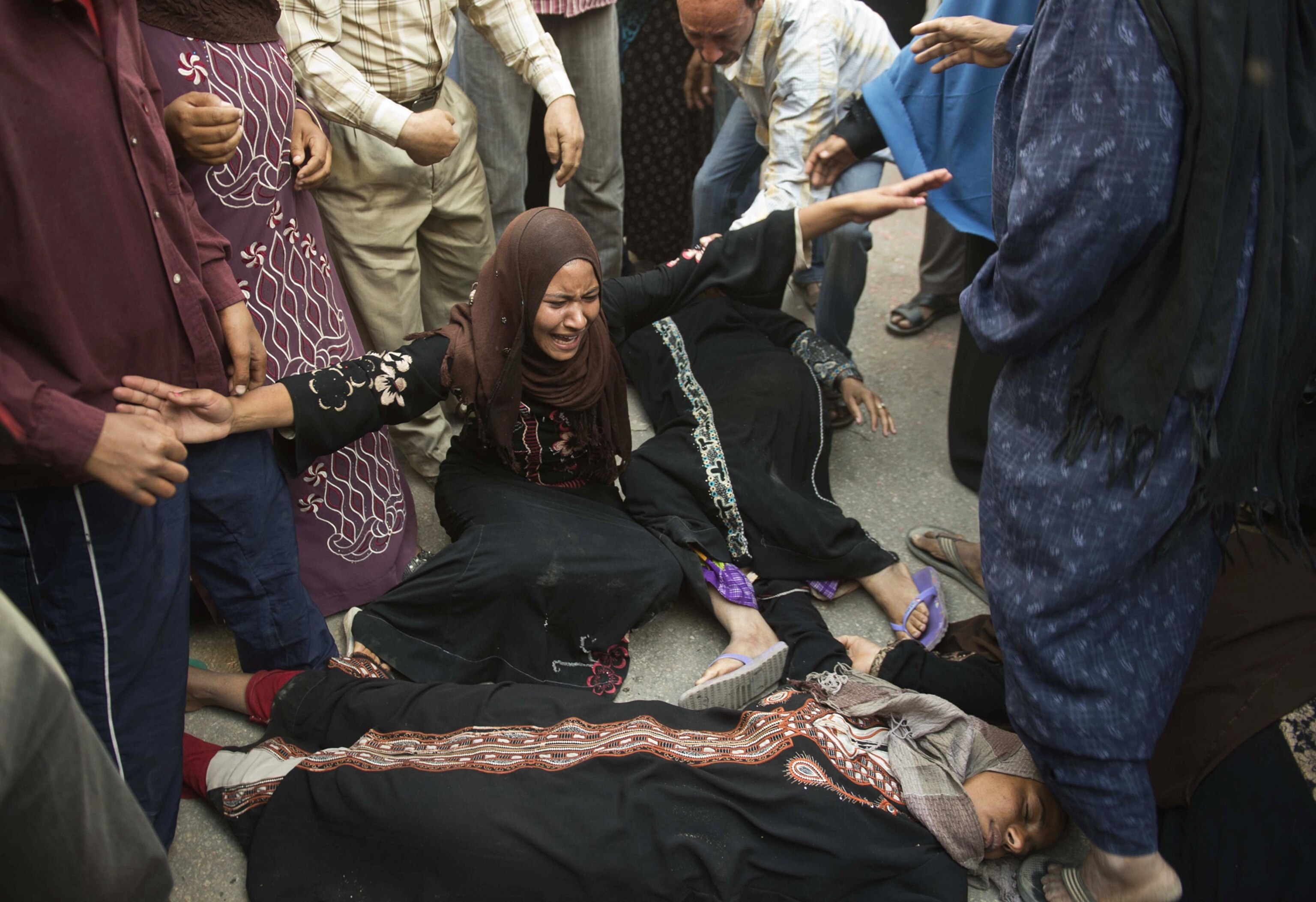 women reacting in the street after the court decision is announced.