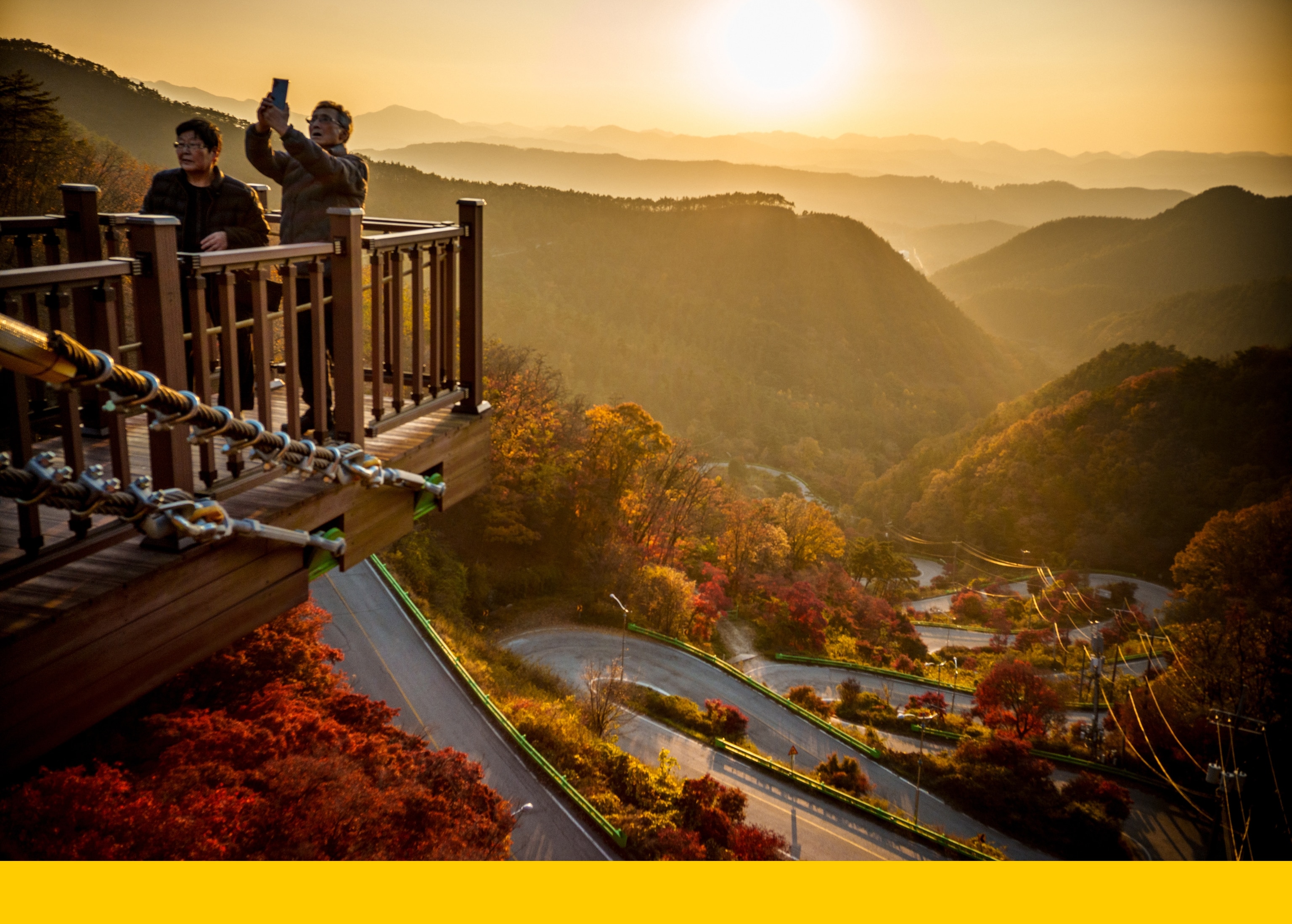 Visitors take photos of Maltijae Pass on the Maltijae Observatory, Boeun-gun, North Chungcheong Province, South Korea
