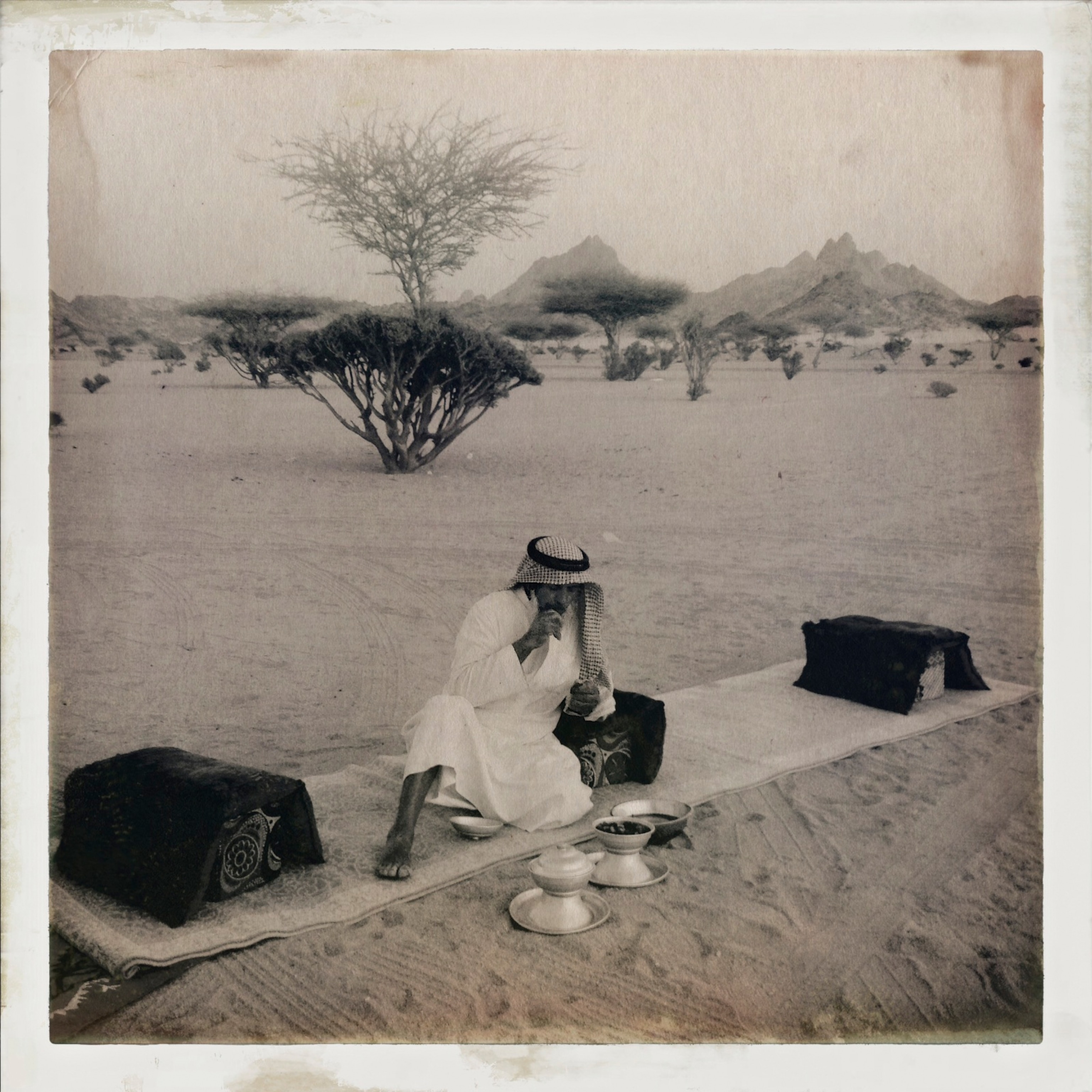 Rabah al rhafe, a Bedouin nomad, breaks his fast with goat milk and Saudi style bread at his families encampment in the desert near Yanbu, Saudi Arabia. He has three wives and over 20 children.