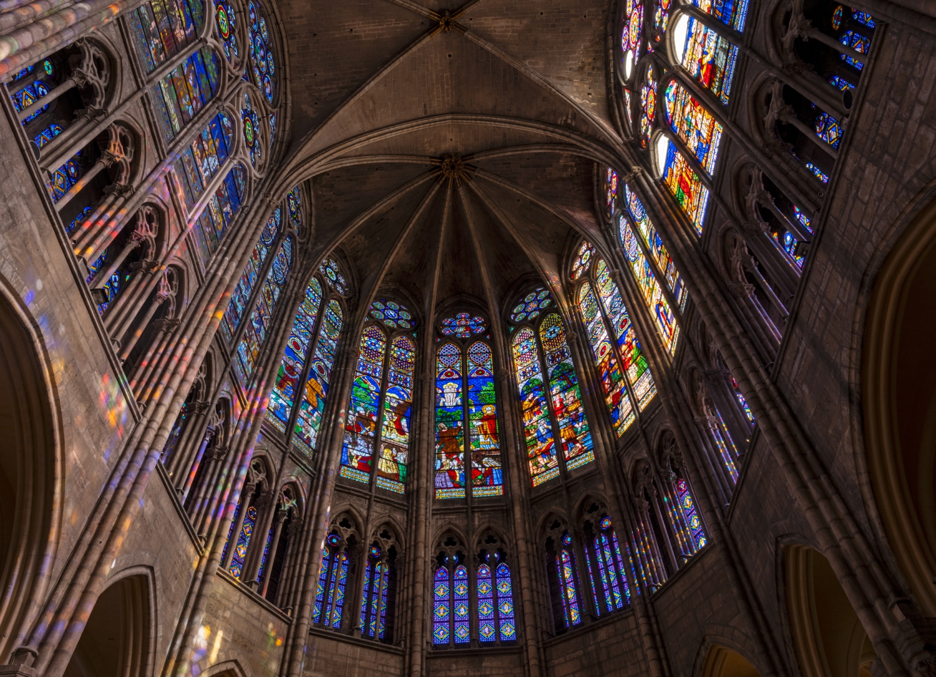 View of the ceiling and stained glass windows.