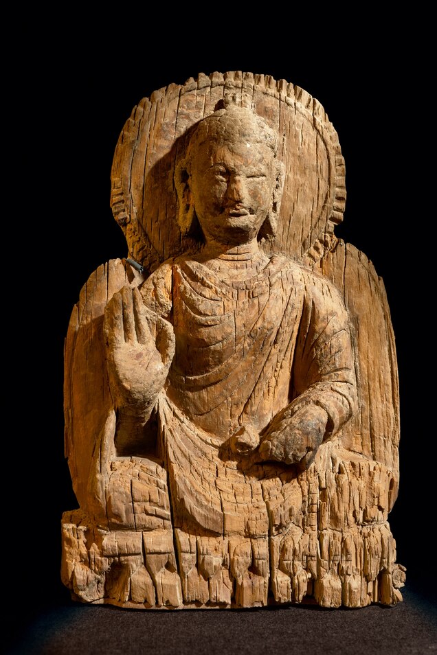 Picture of wooden Buddha stature.