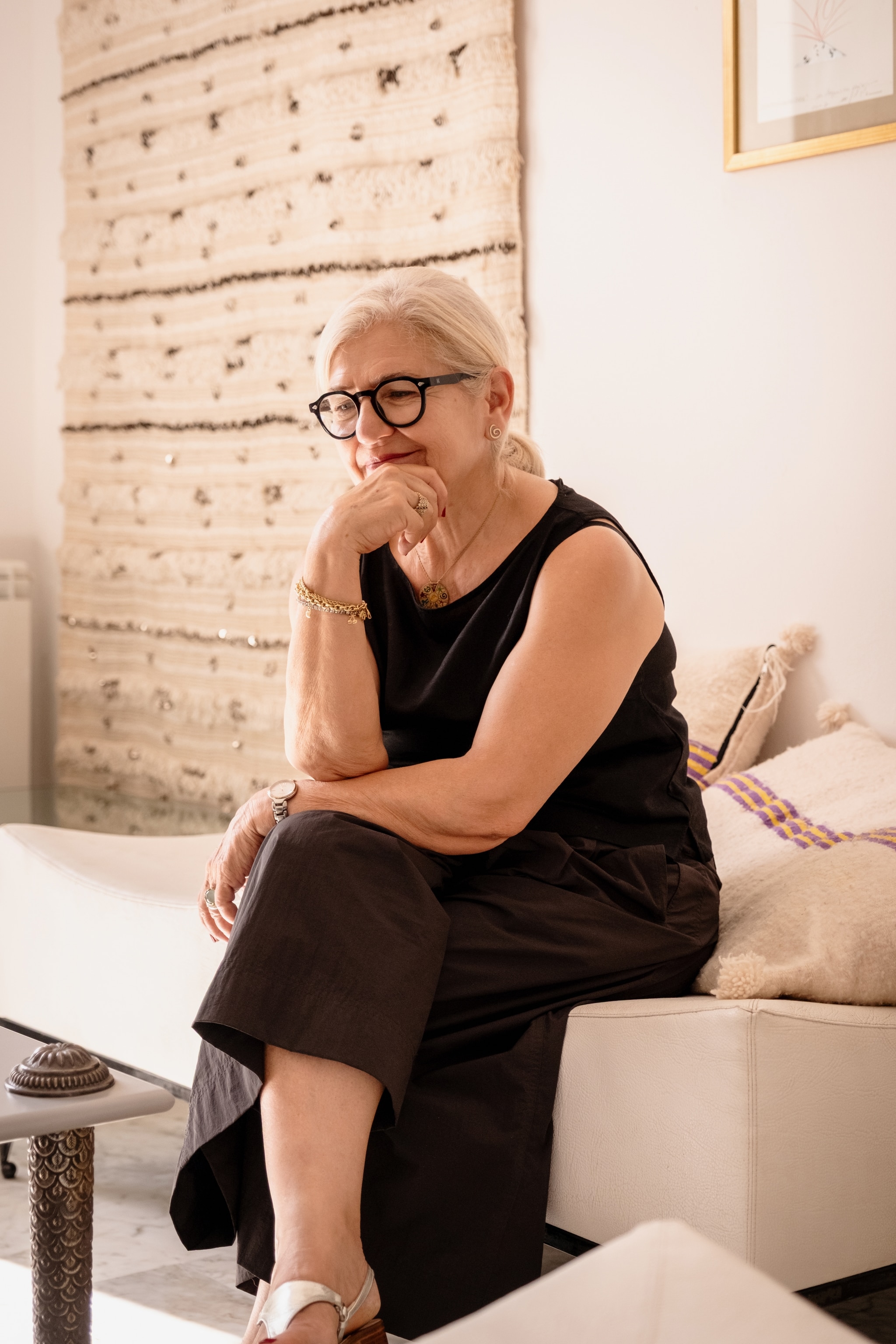 Woman sat on white sofa