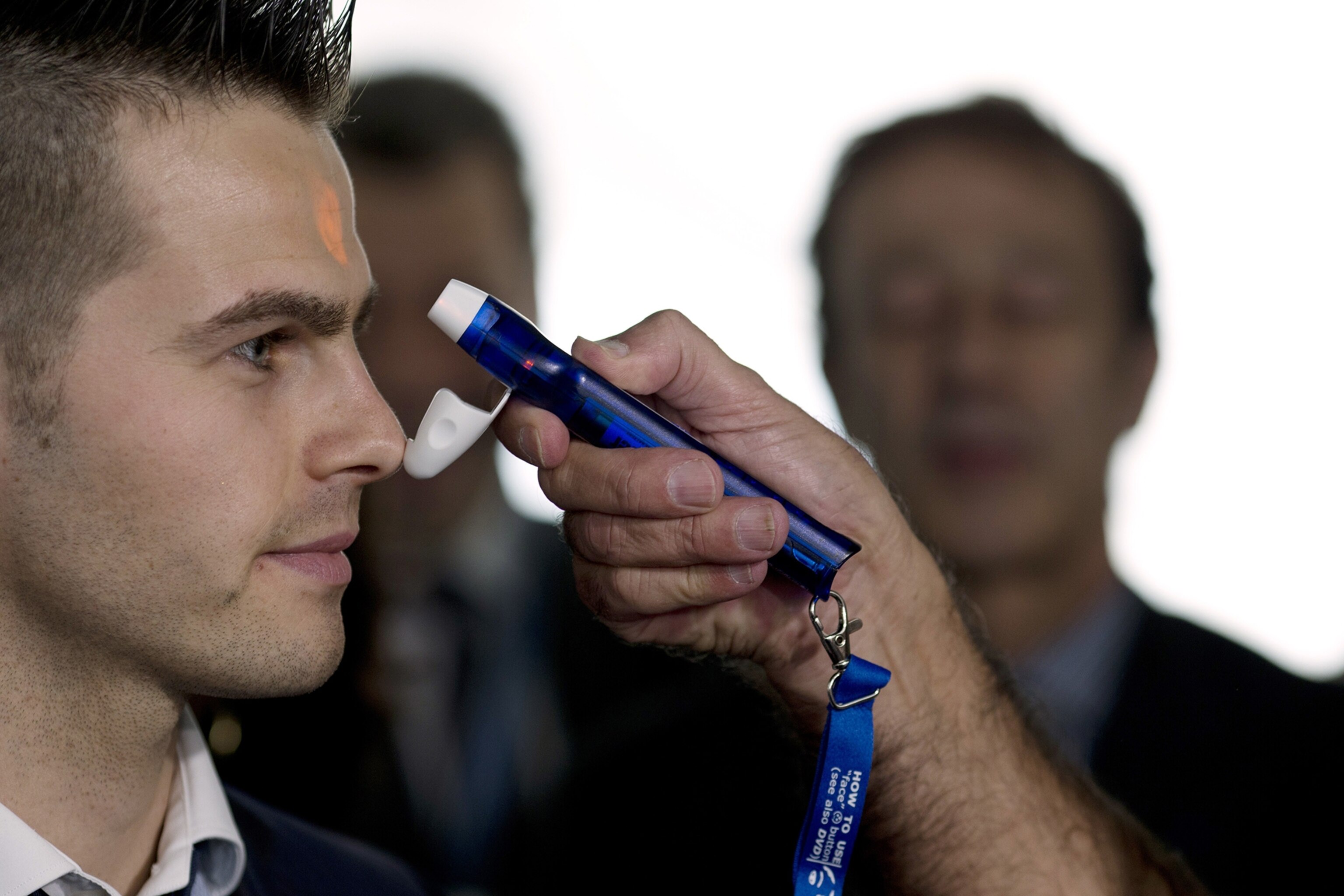 Dr. Steven Hatch, second from right, and colleagues dress into protective clothing before a shift at a clinic run by the International Medical Corps in Suakoko, Liberia, Oct. 12, 2014.