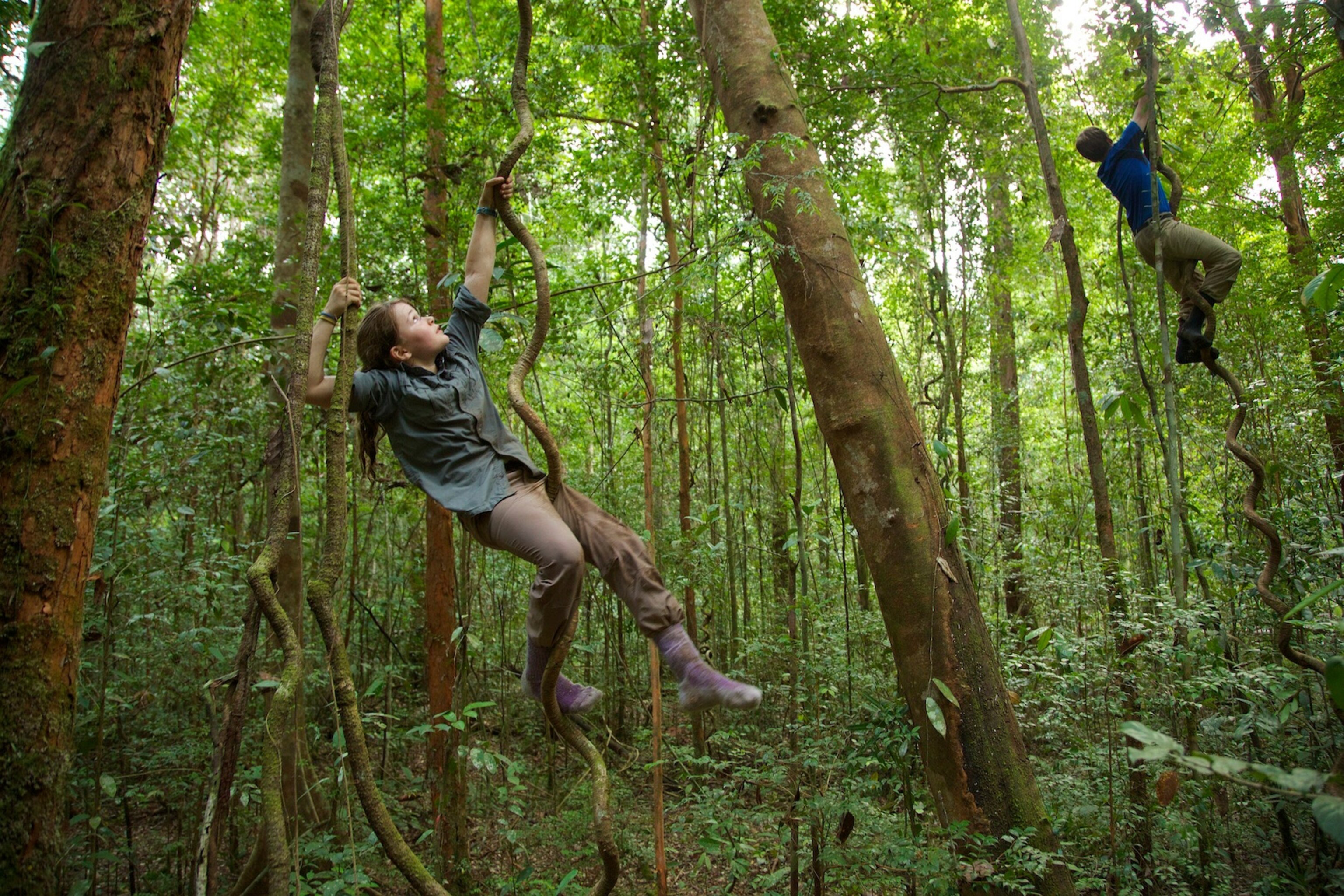 Jessica and her brother Russell climbing vines like orangutans