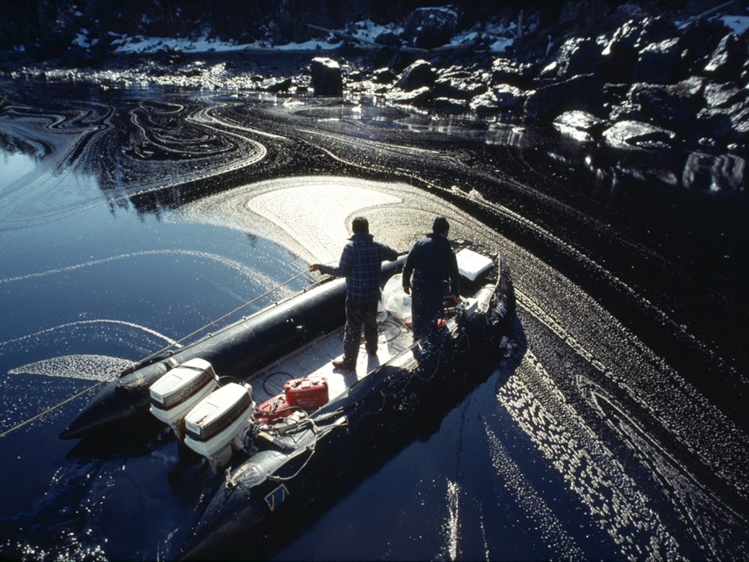 Days after the spill, fishermen confront oily gunk a foot thick clogging a bay on Eleanor Island - about 35 miles from the wrecked tanker