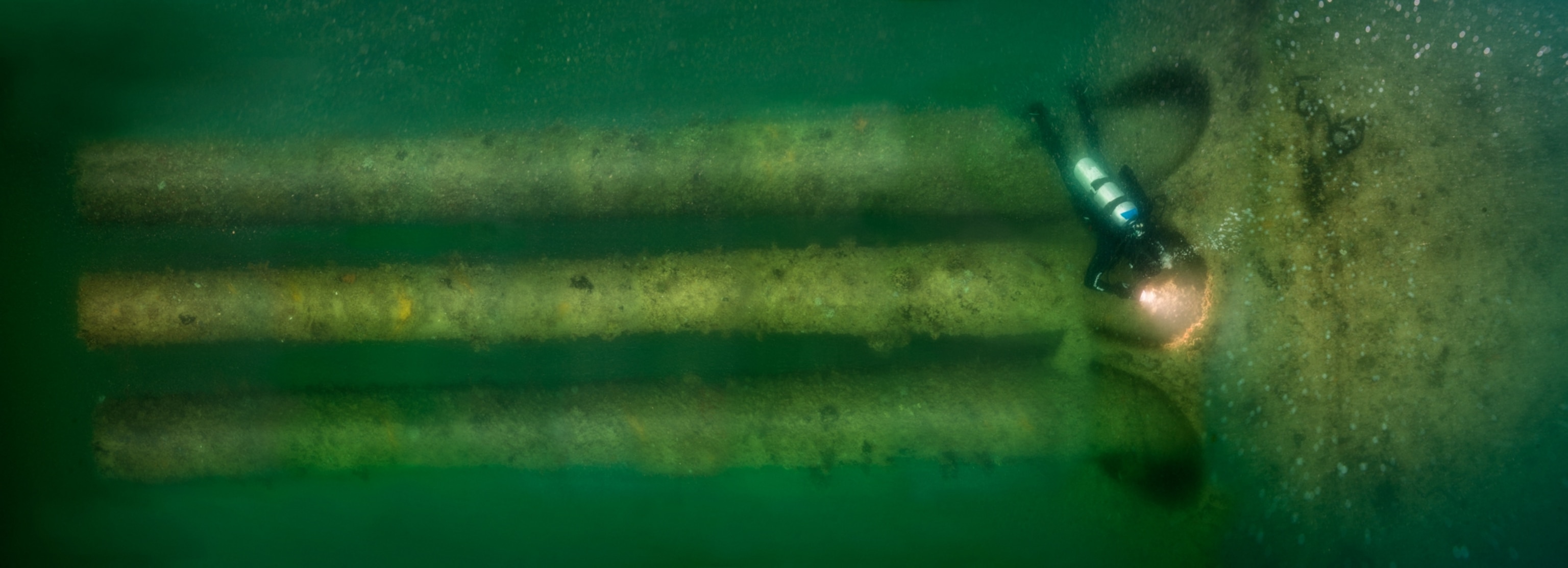 3 large gun turrets and diver underwater