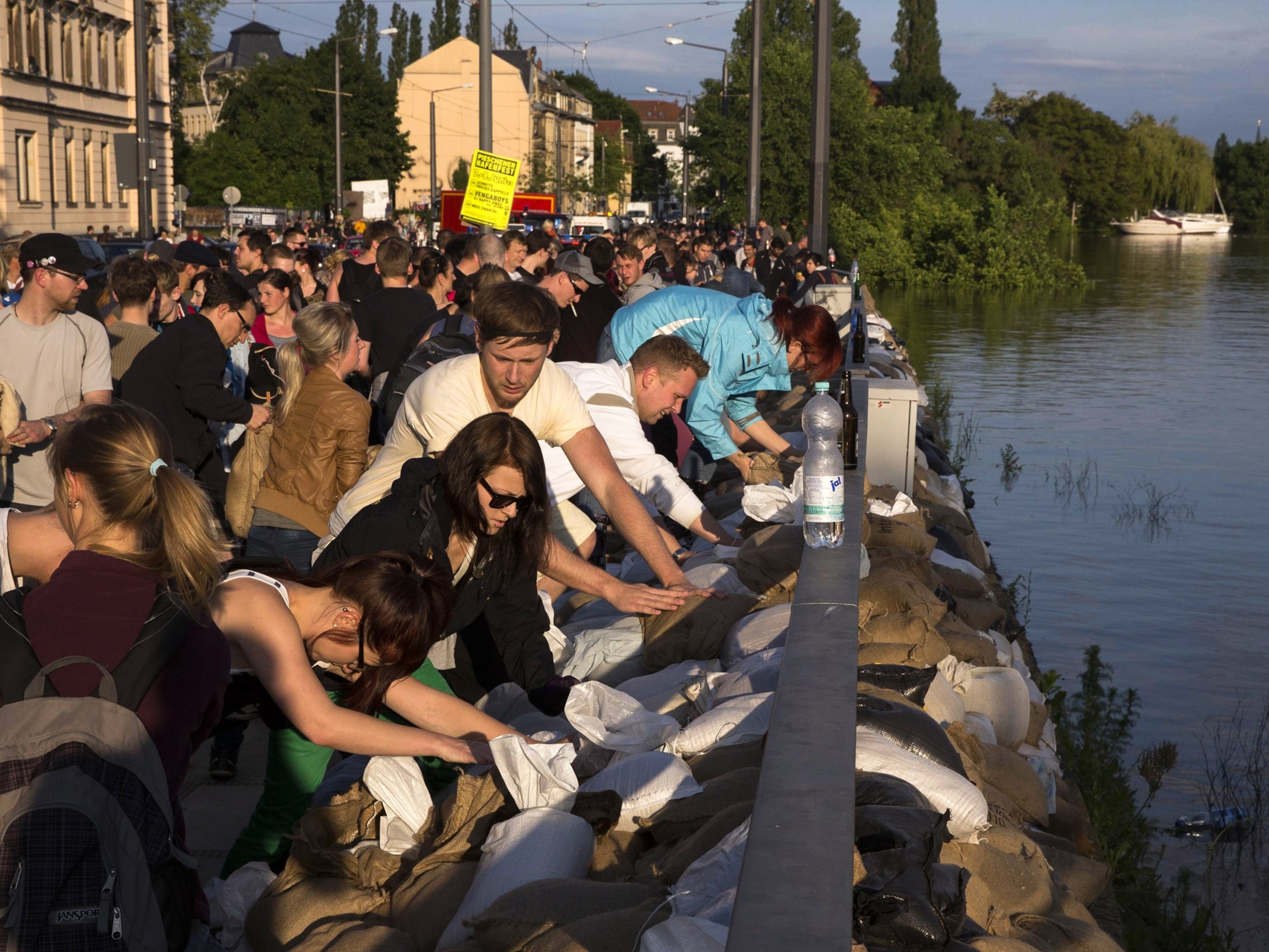 European Flooding - Picture of volunteers stacking sandbags during a flood.