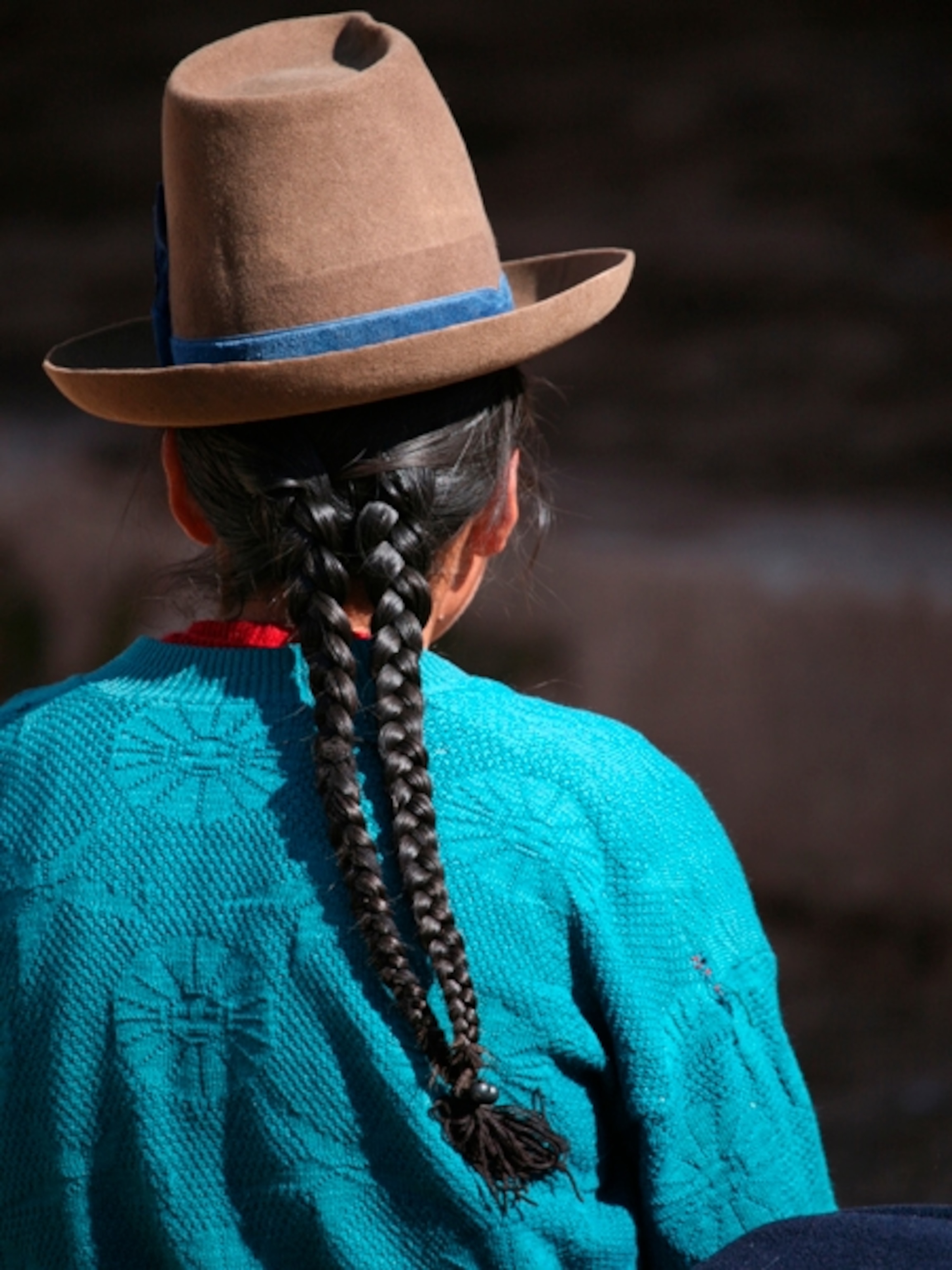 man with braid at market at Chinchero