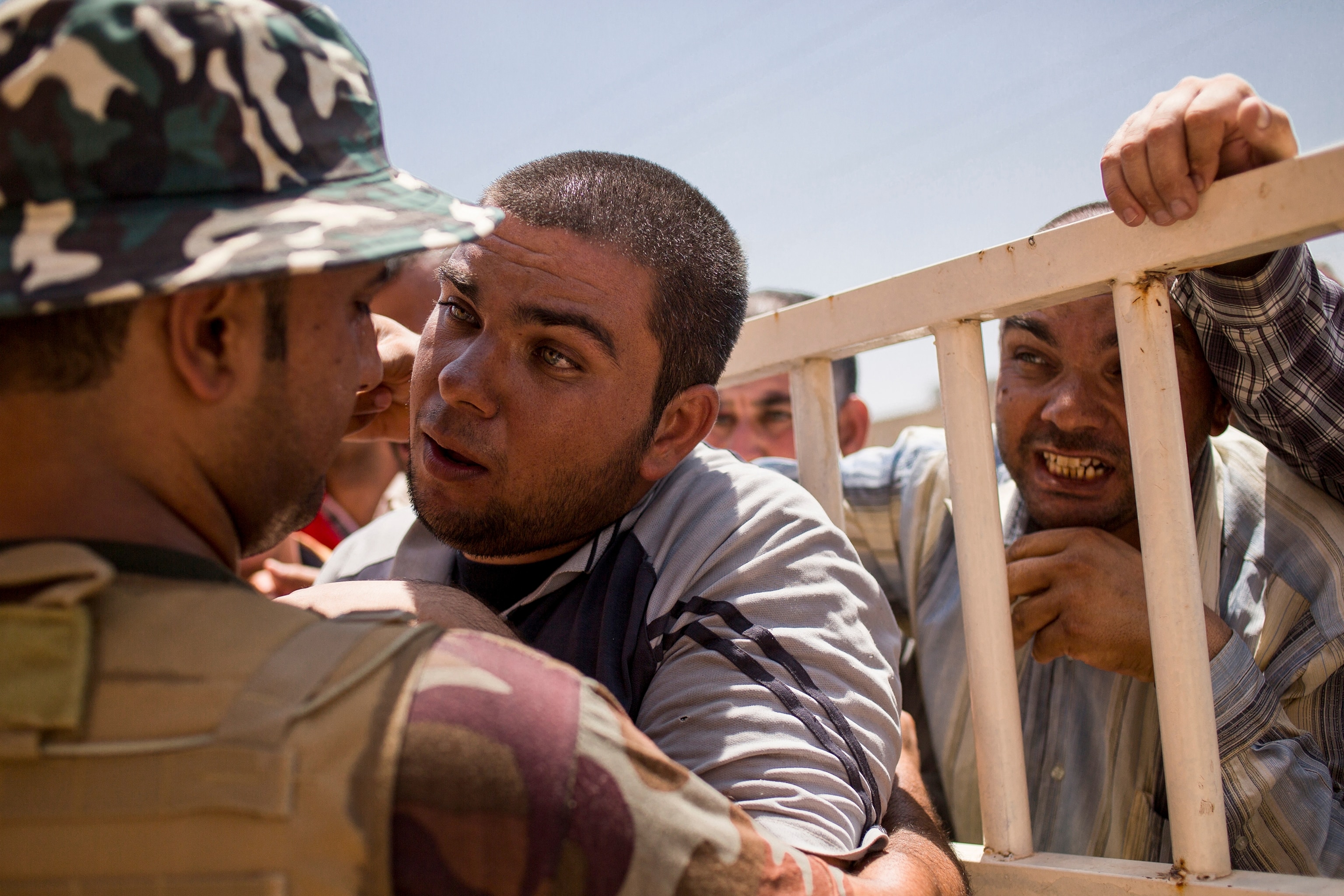 woman kissing a small boy in front of the Mar Tshmony church.