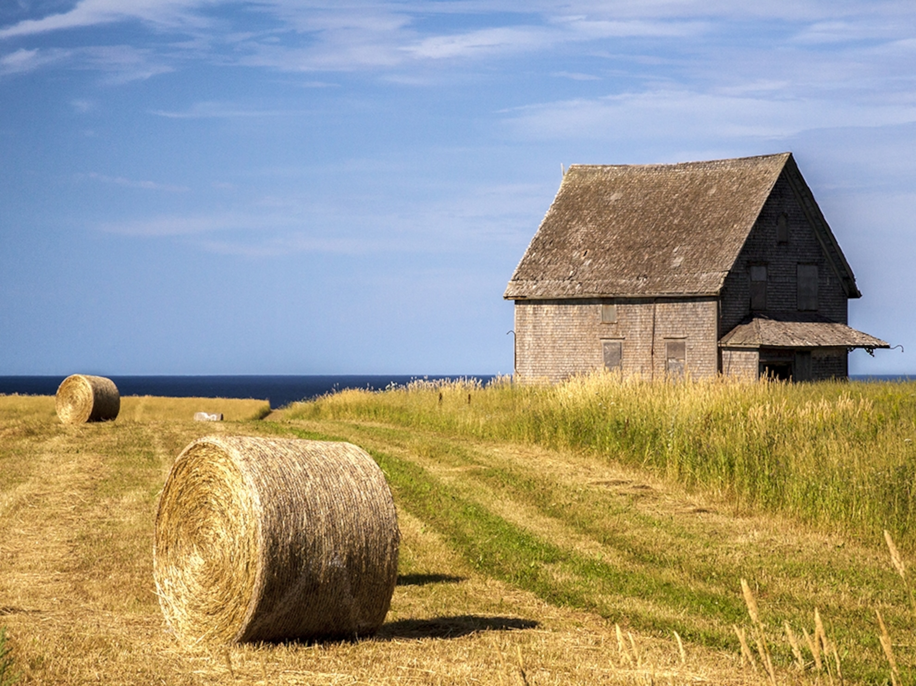 hay bales and a barn on Prince Edward Island, Canada