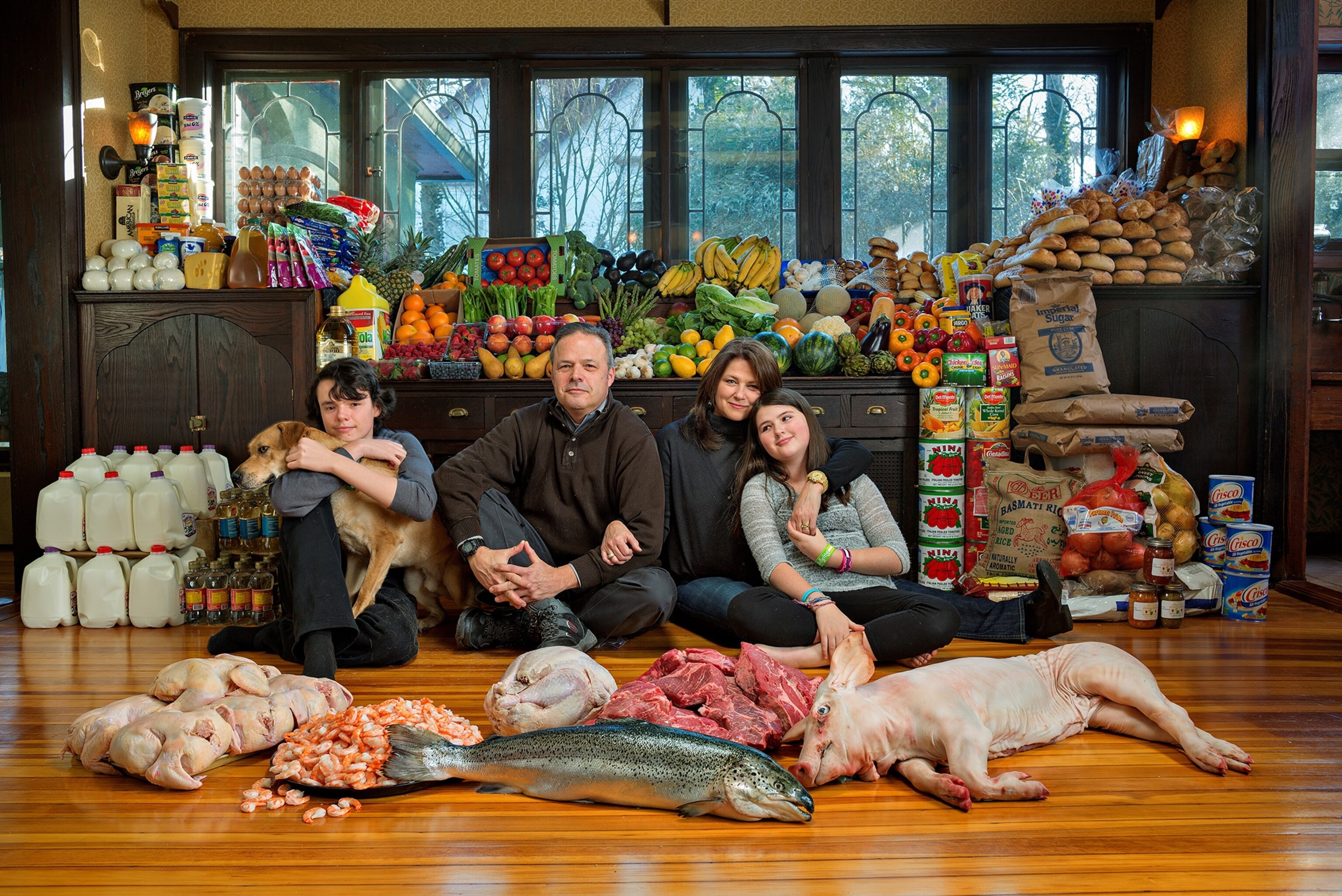 a family surrounded by food