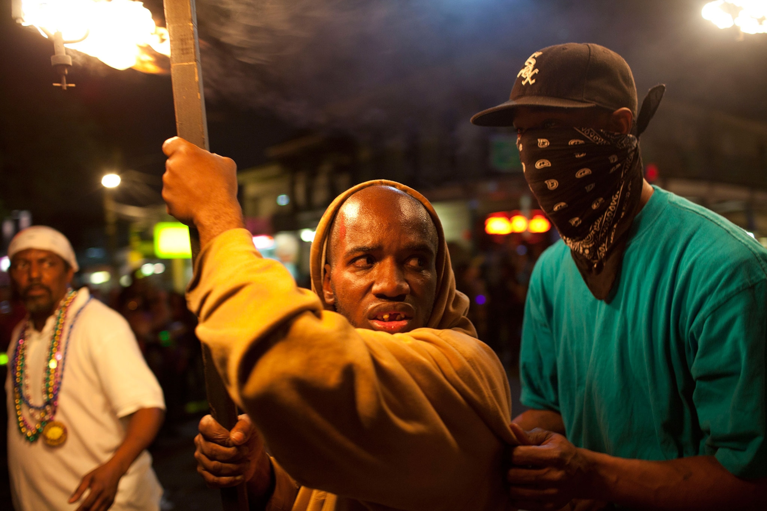 flambeau carriers during Mardi Gras in New Orleans