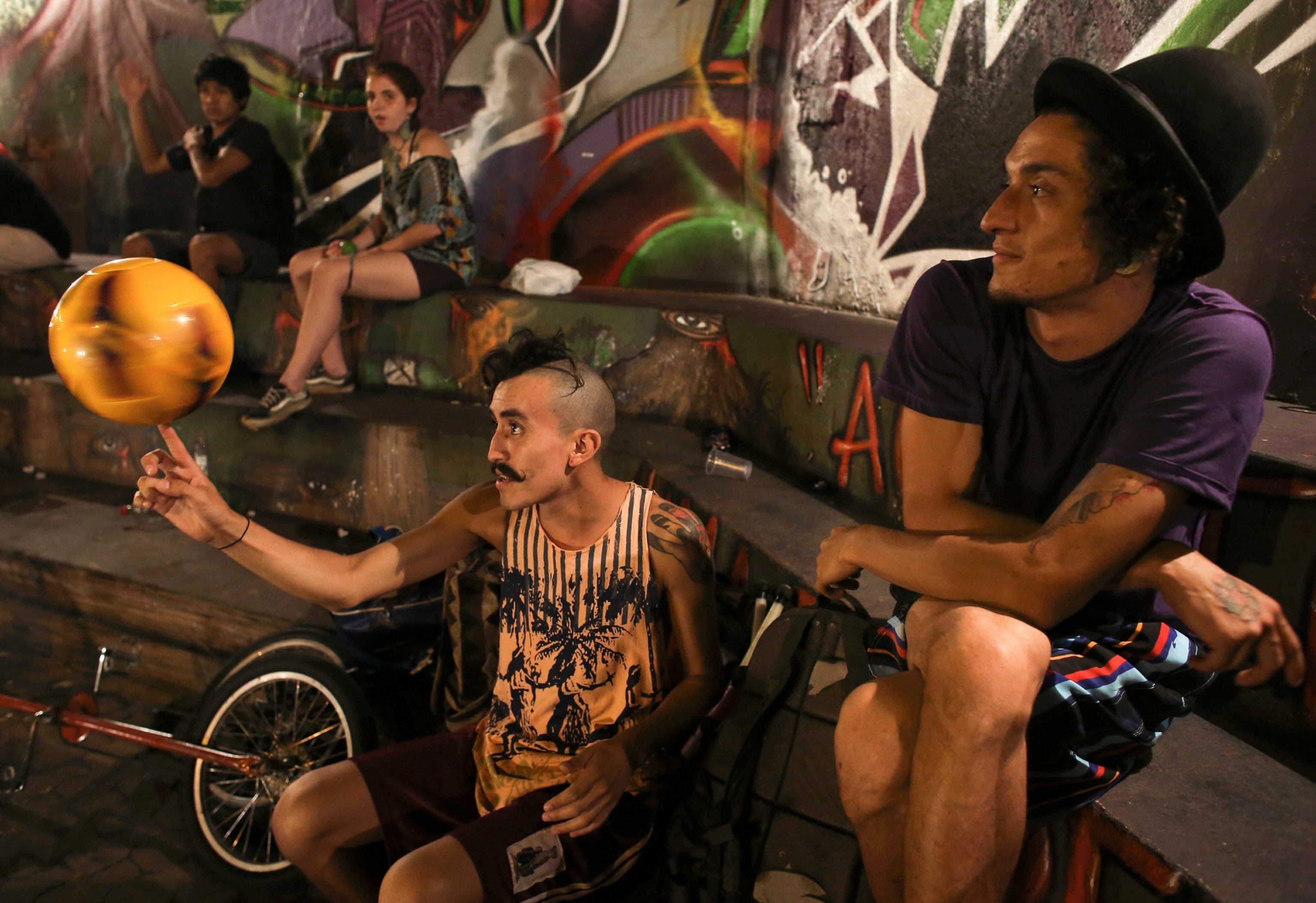 Circus of the Alley - A picture of a man spinning a ball in São Paulo, Brazil