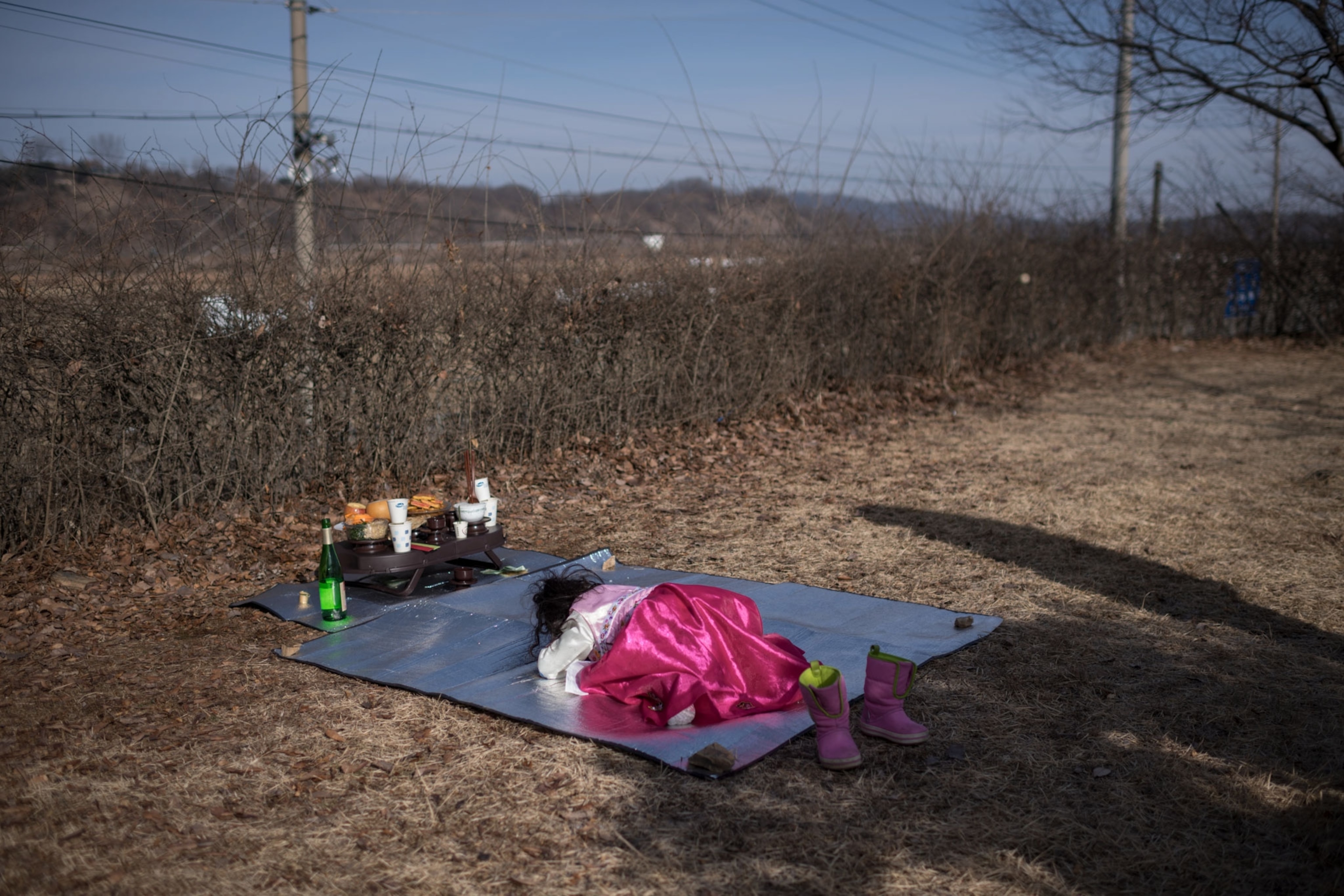 a girl offering a prayer in North Korea