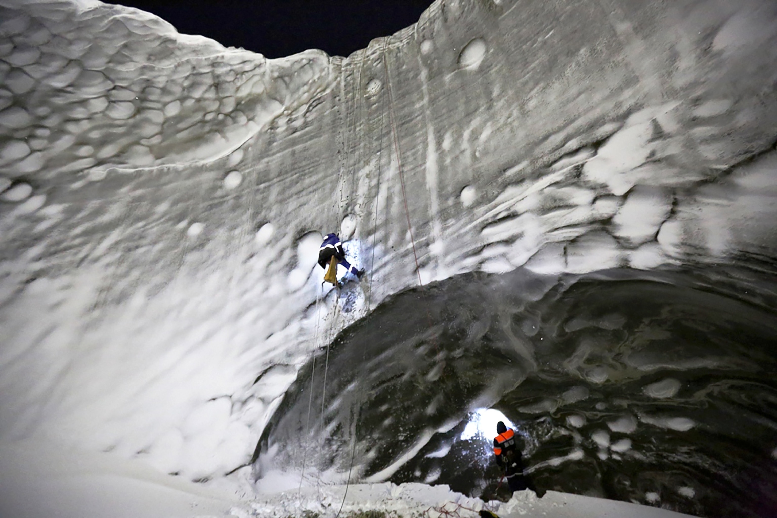 scientists exploring the bottom of the Yamal crater.