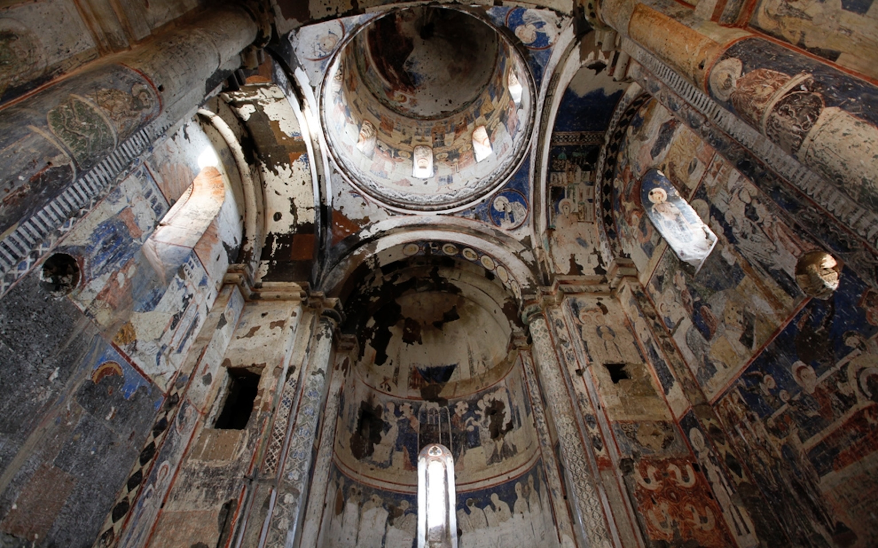 Picture of damaged frescoes inside a medieval church in Turkey.