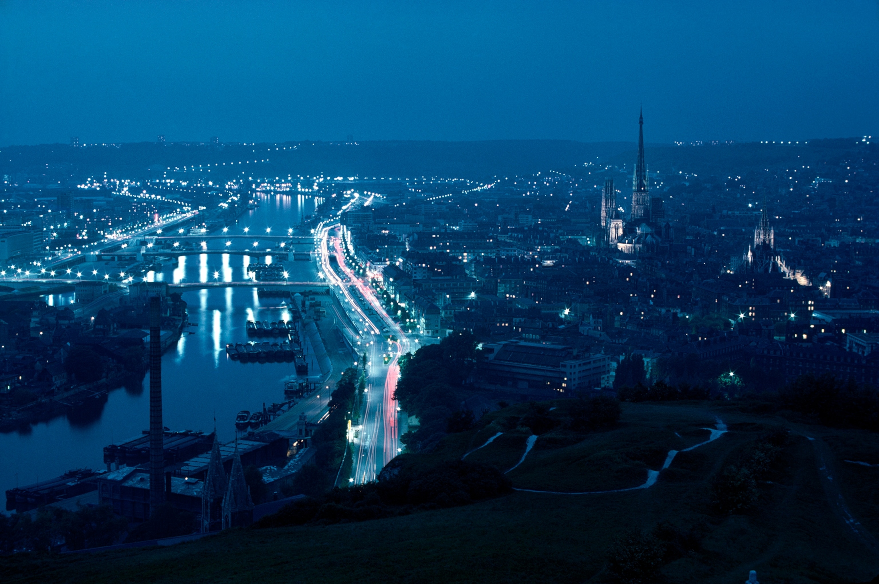 Rouen's cathedral dominates nighttime skyline.