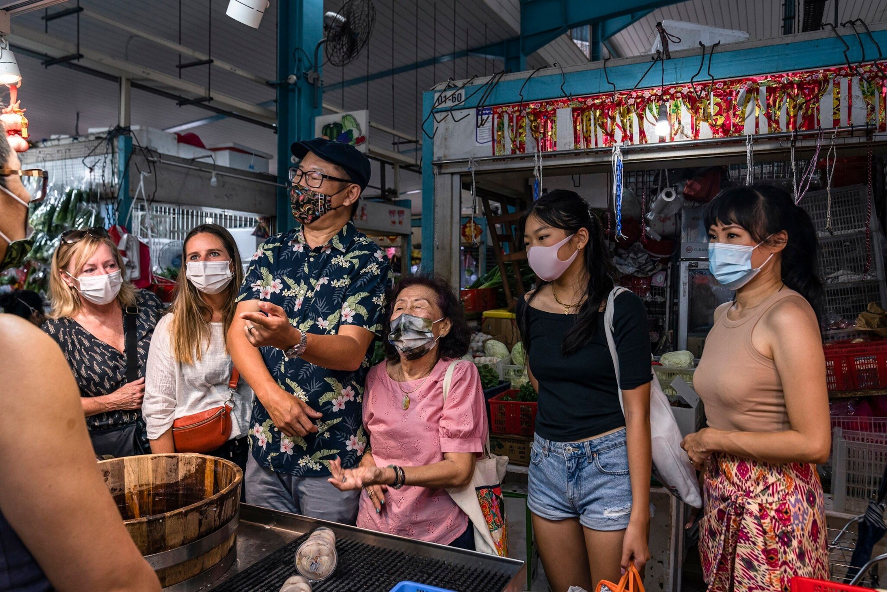 Bushels of fragrant, hanging herbs drape the stalls that line Singapore's colourful markets.
