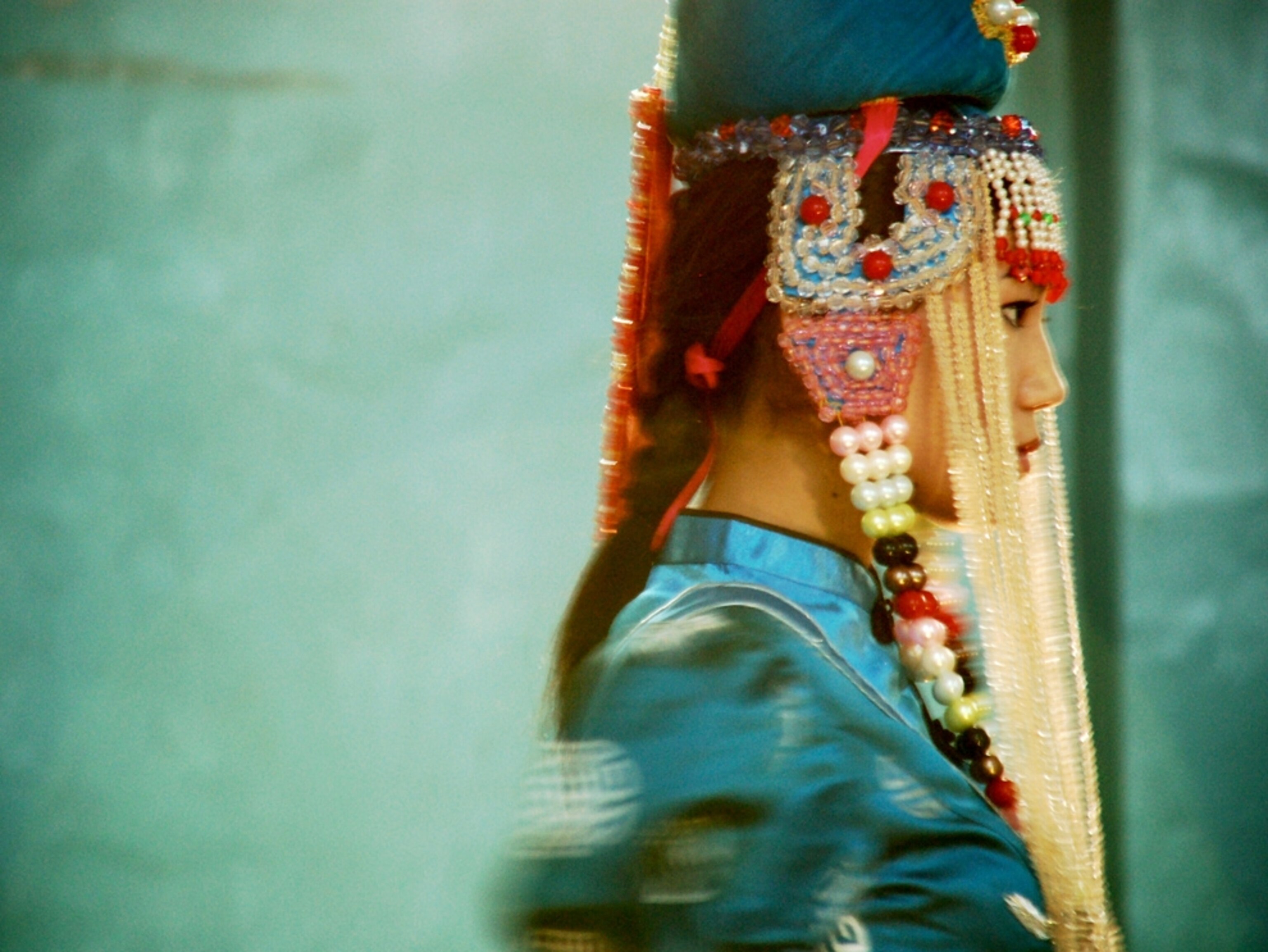 A woman wearing an elaborate headdress