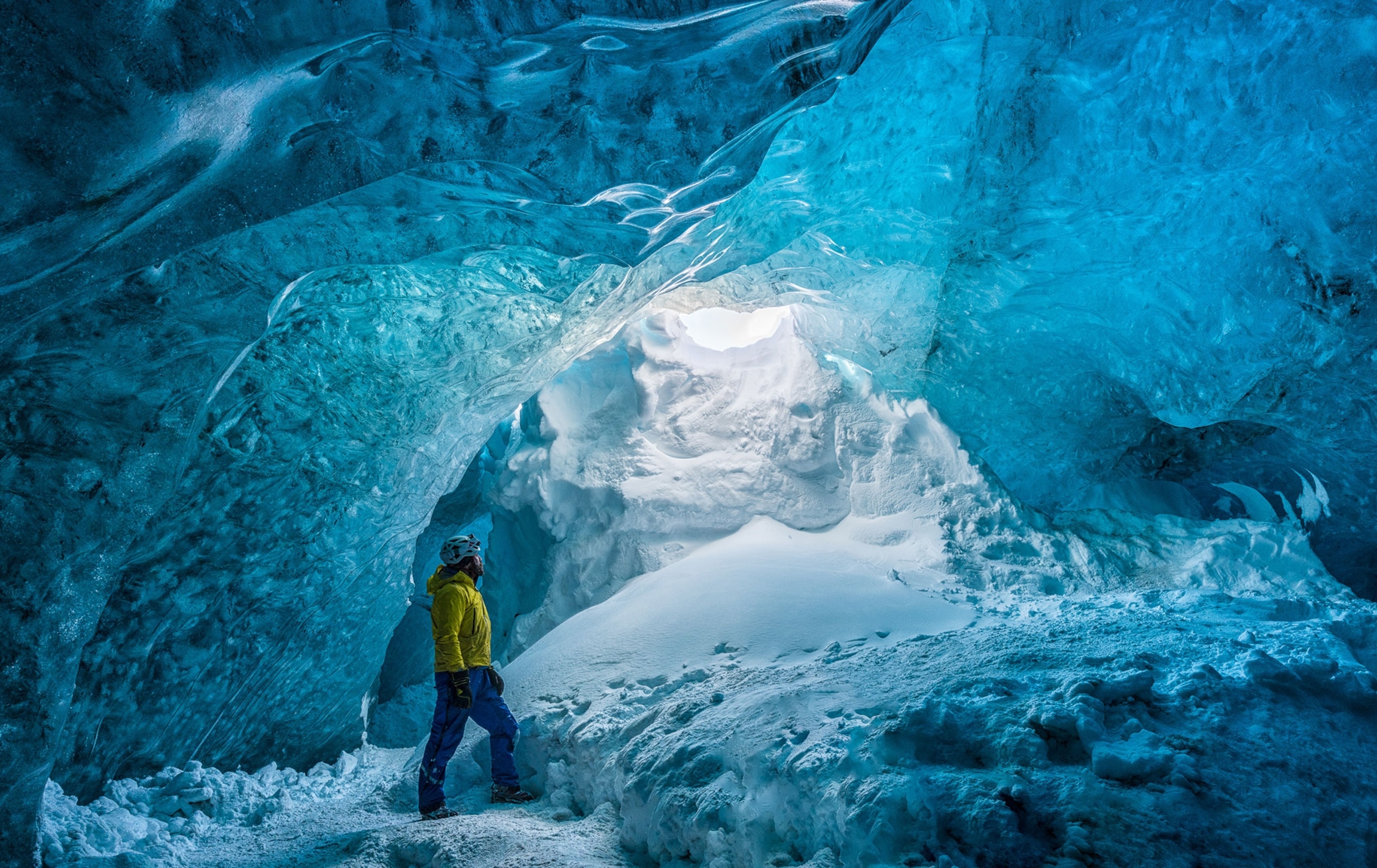 a man exploring glaciers in Iceland