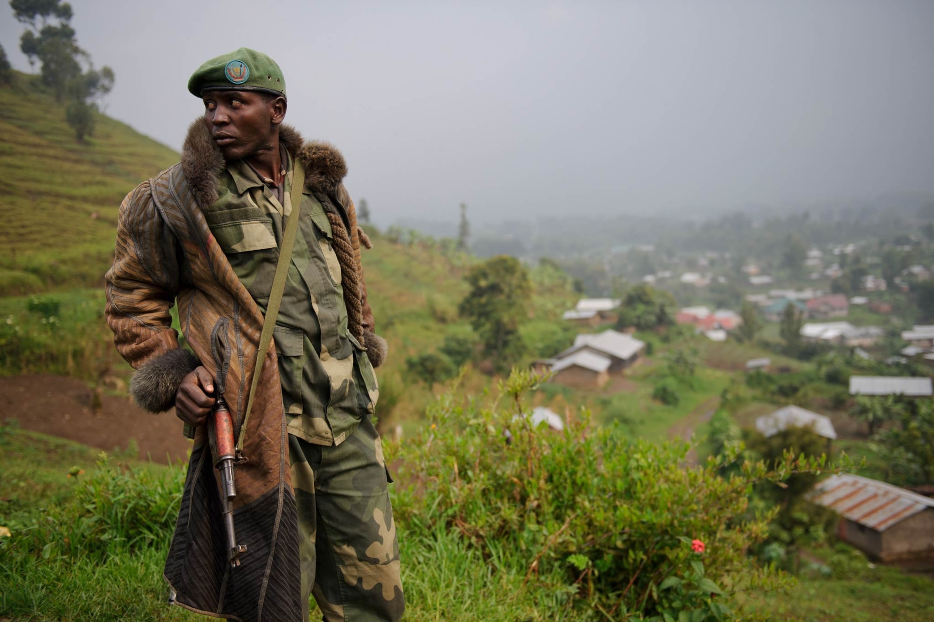 Congolese commandos celebrate as they advance up the mountainous road toward Bunagana, the last remaining stronghold of the M-23 rebels on Wednesday.(Pete Muller for the New York Times)