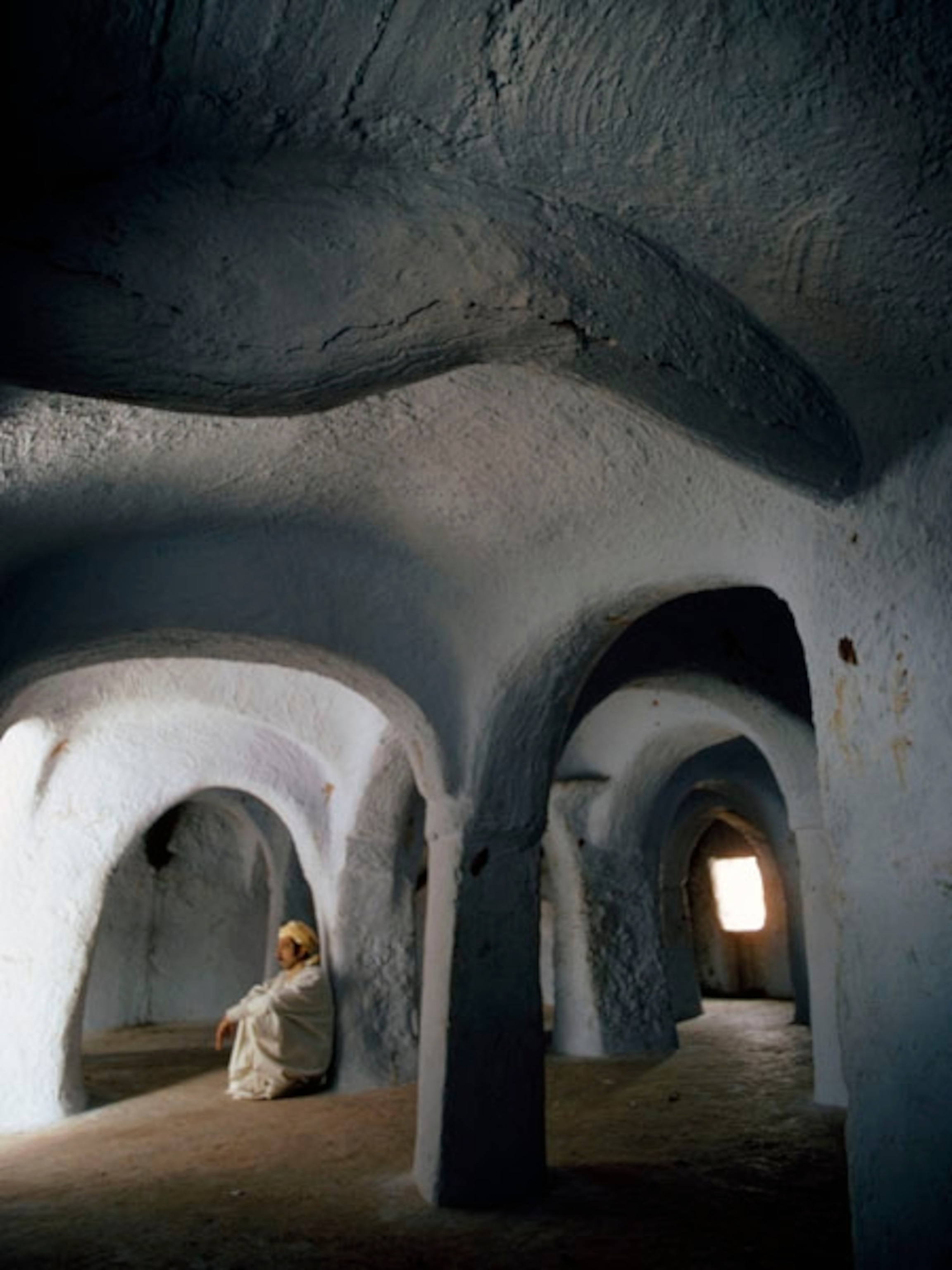 A man meditating at a mosque