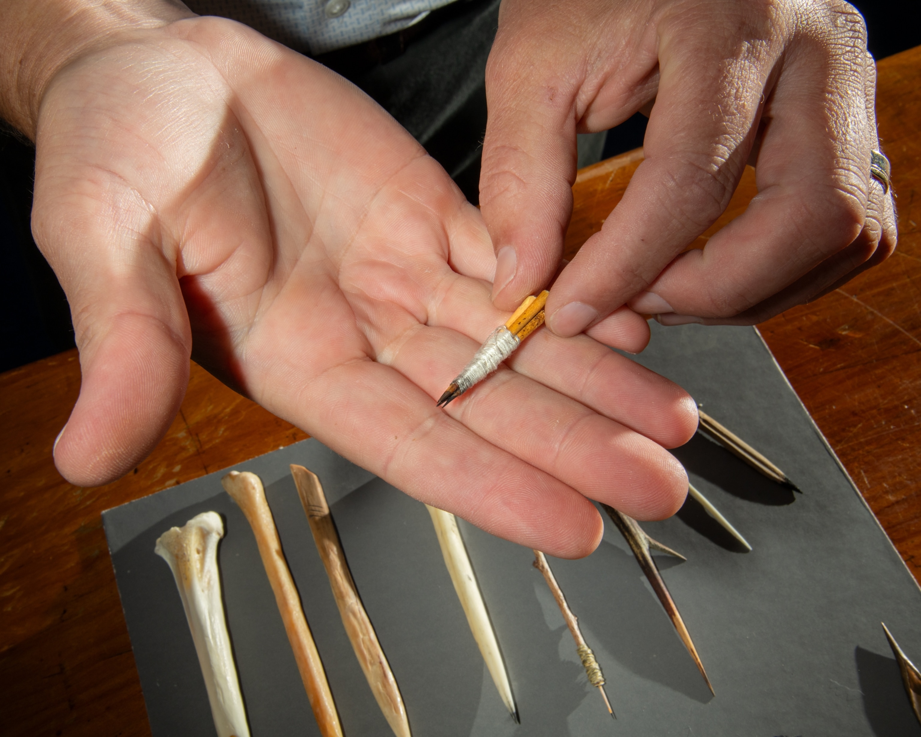 Hand displaying object looking like a pencil.