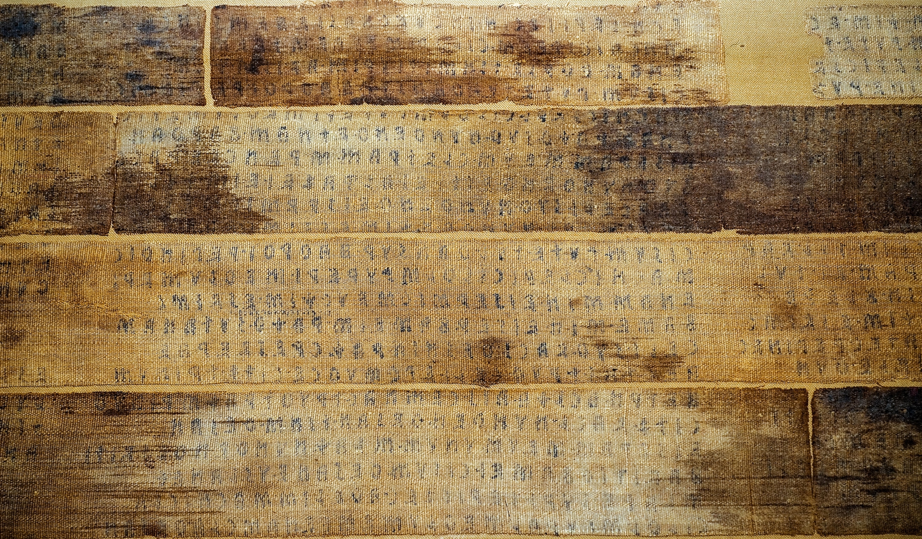 Tan and worn cloths with faded black lettering