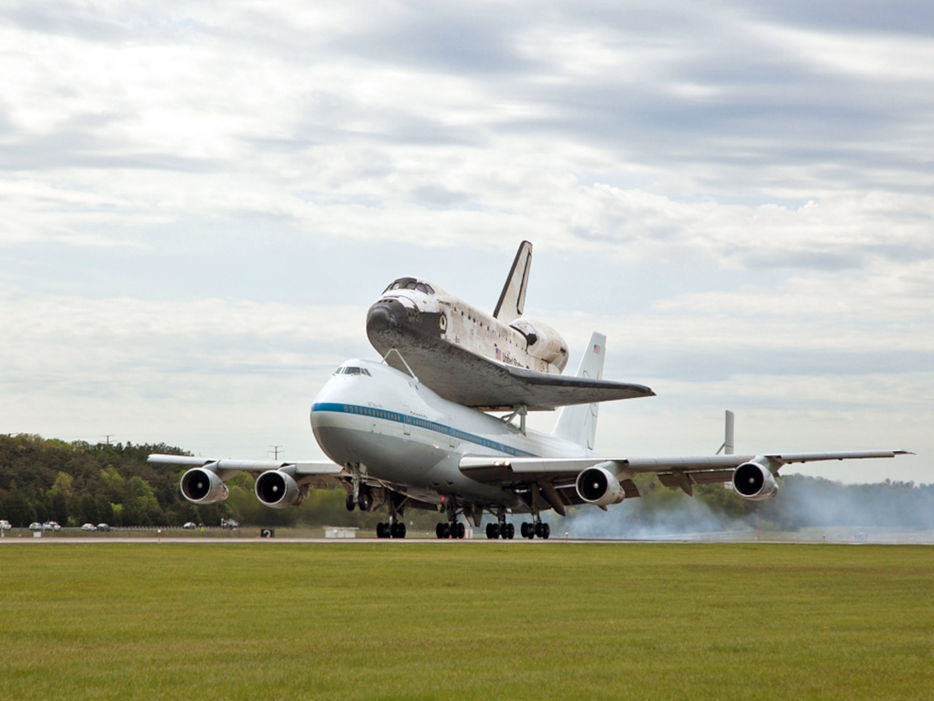 The space shuttle Discovery atop another airplane.