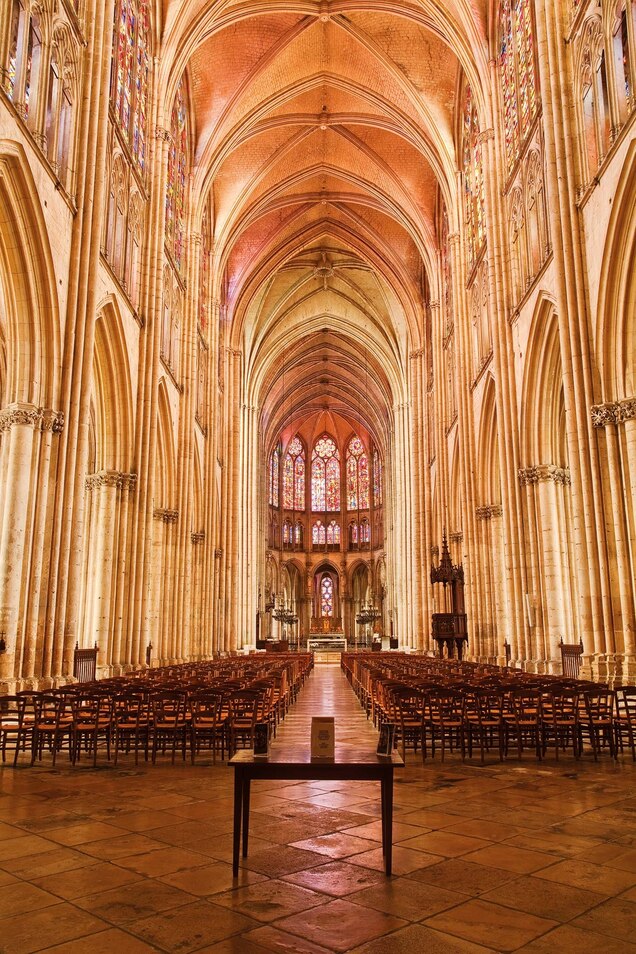 A view of the altar and pews in the Cathédrale Saint-Pierre-et-Saint-Paul in Troyes, France