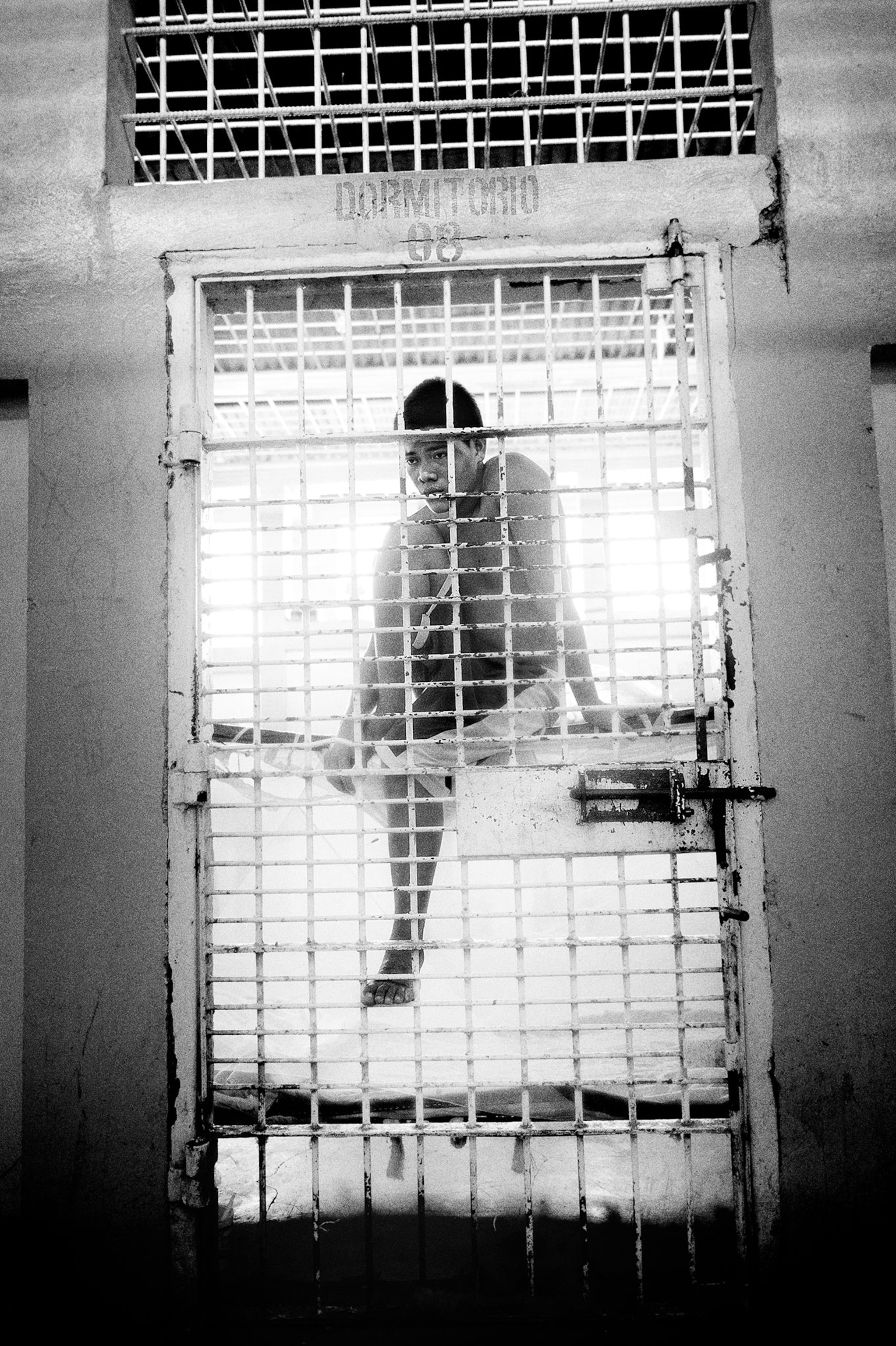 a Nicaraguan teenager inside a prison cell