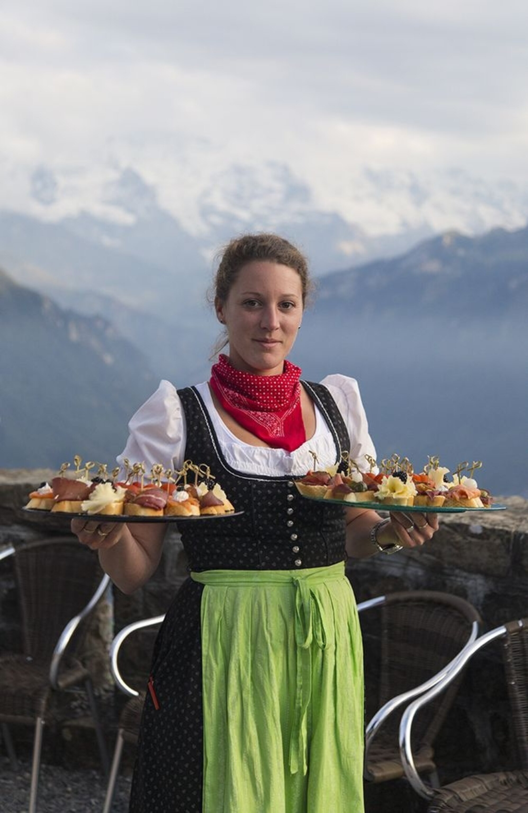 a costumed server with trays of hors d'oeuvres, Harder Kulm, Interlaken, Switzerland