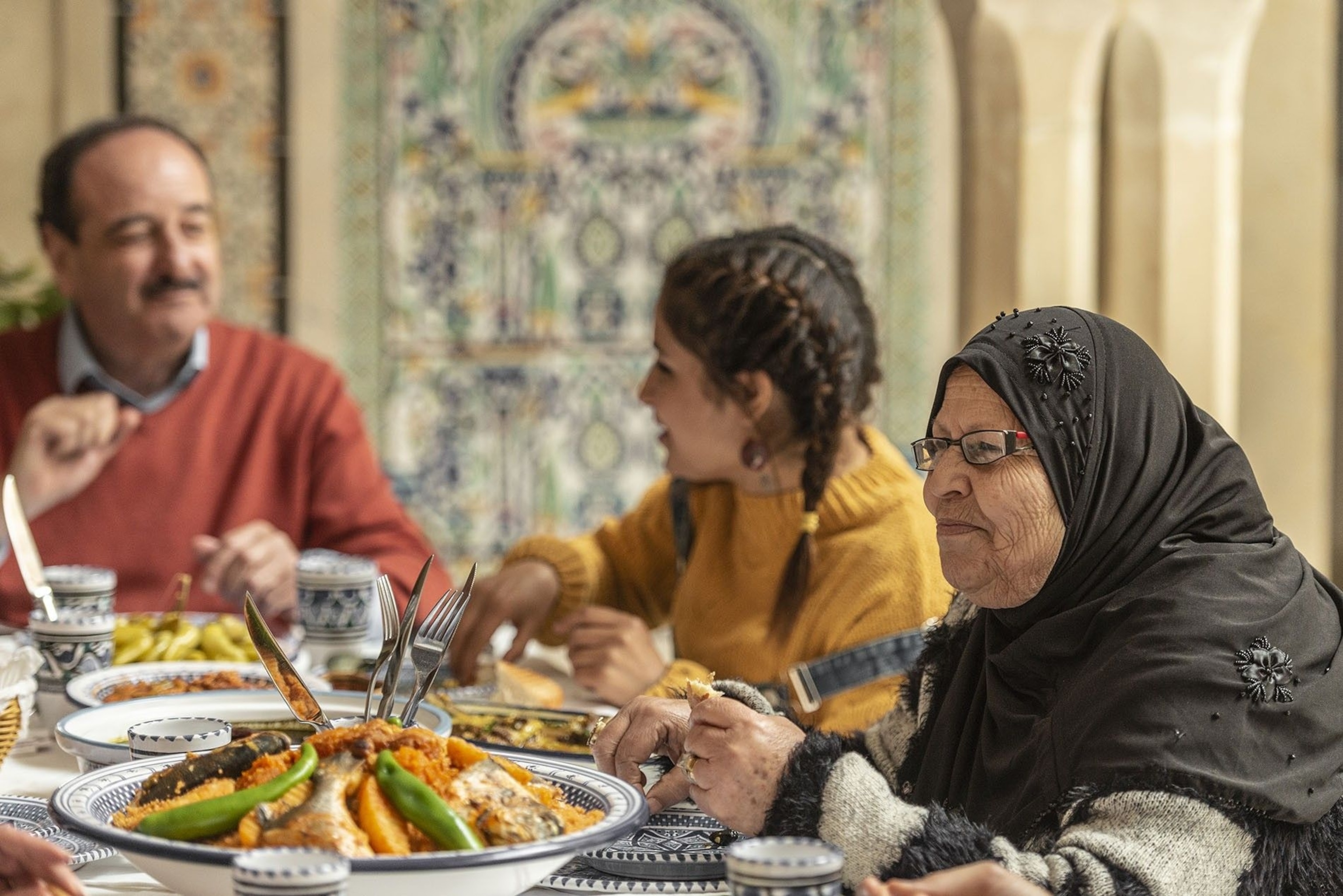 A family tucks into lunch in Nabeul, Tunisia.