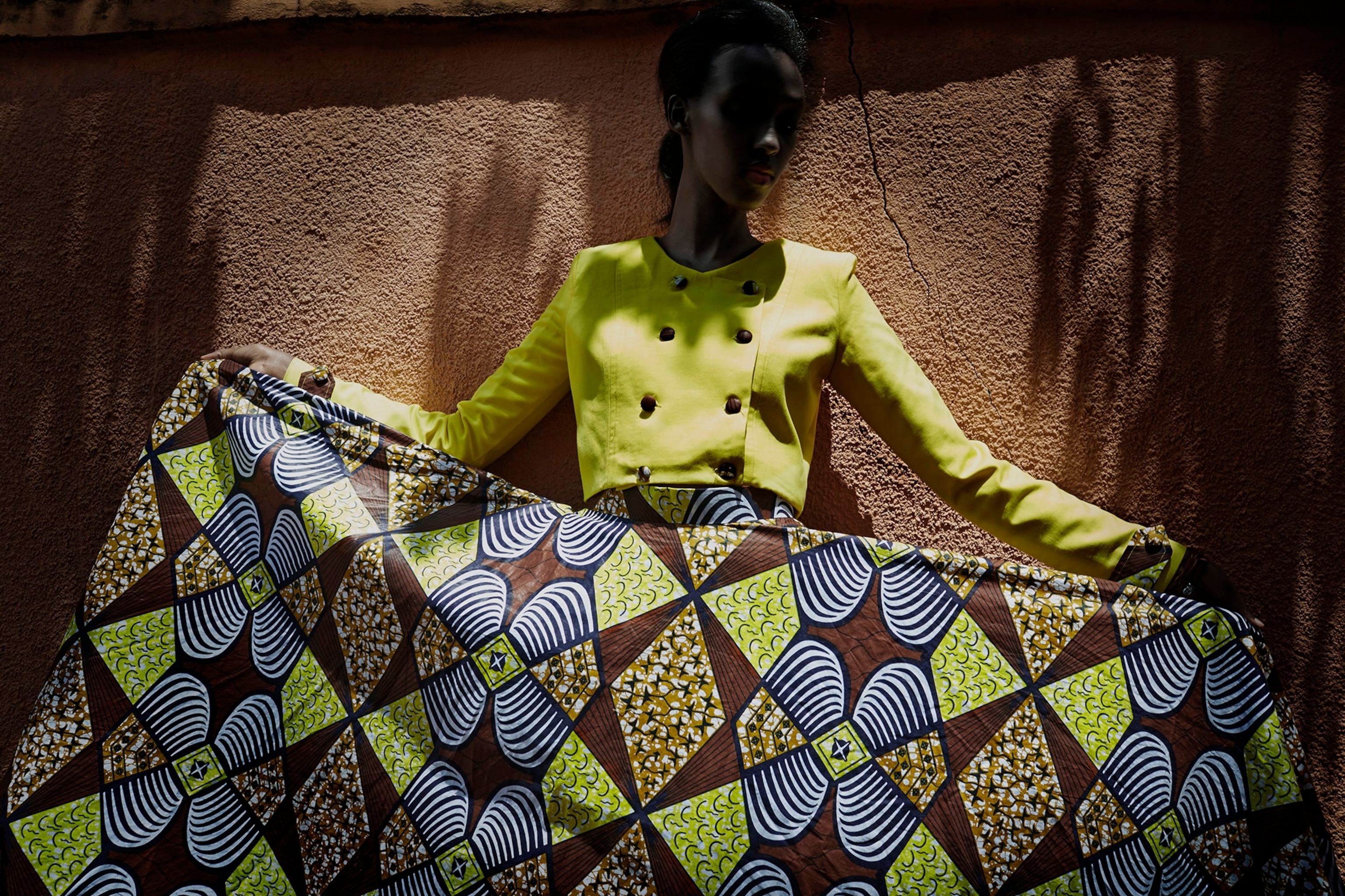 A model fits a dress by Ugandan Designer Santa Anzo, (Arapapa by Santa Anzo label) a few days before the gala night at Kigali Fashion Week held at Kigali City Towers in Kigali, Rwanda.