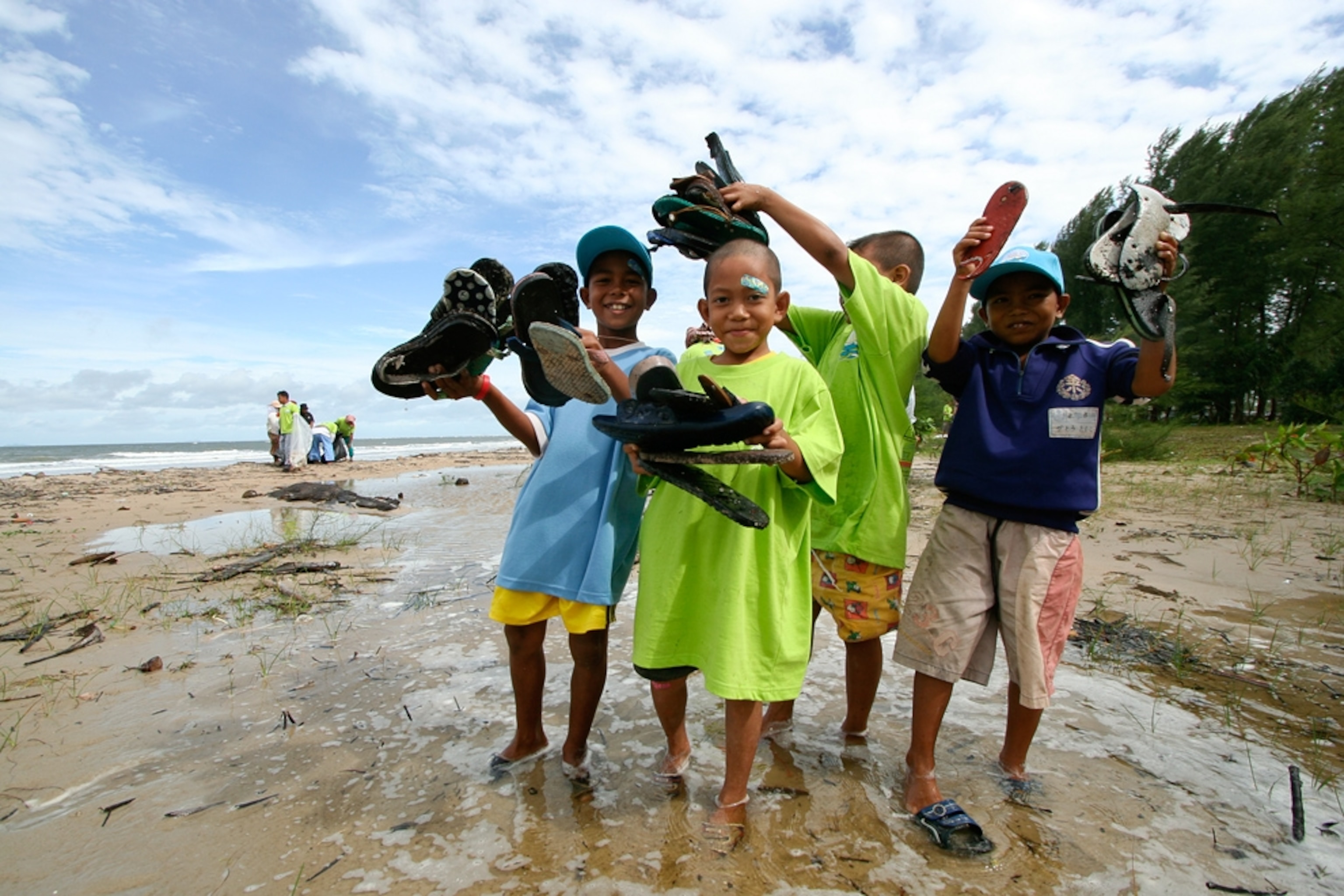 Children picture: kids cleaning up a beach in Thailand, which won an honorable mention for the "Most Hopeful" photograph
