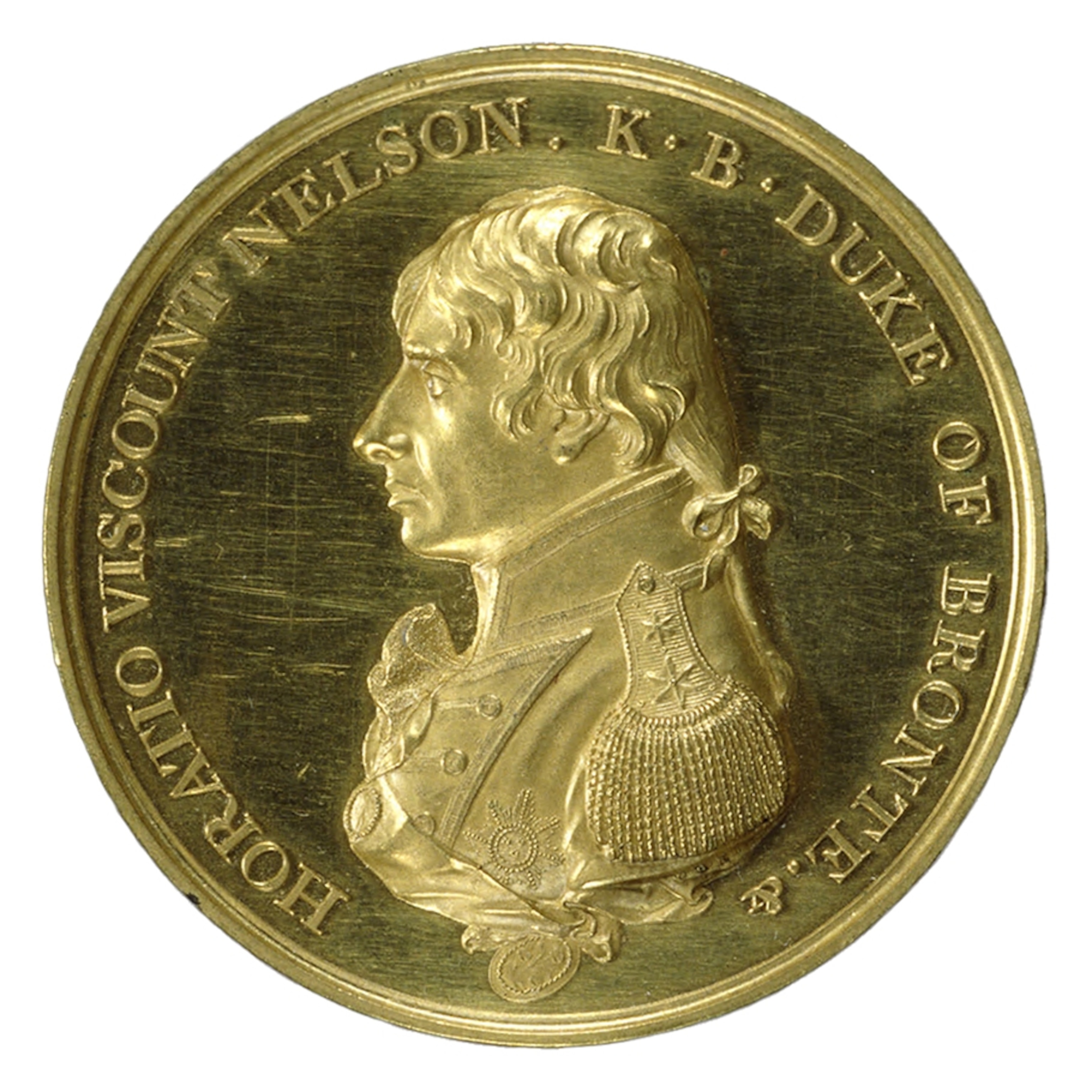 The face of a gold medal which has a side portrait of a man