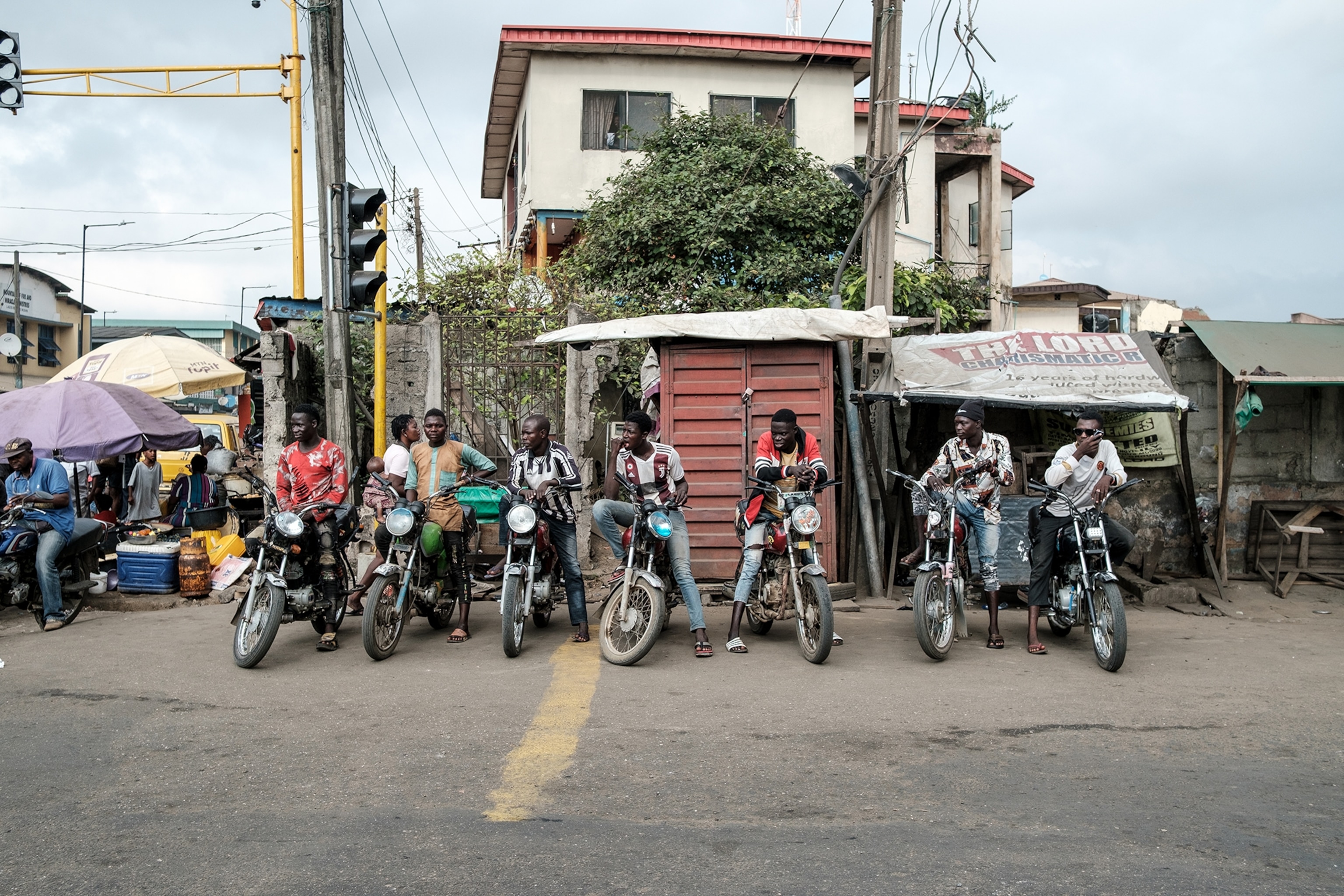 A row of parked Okada riders.