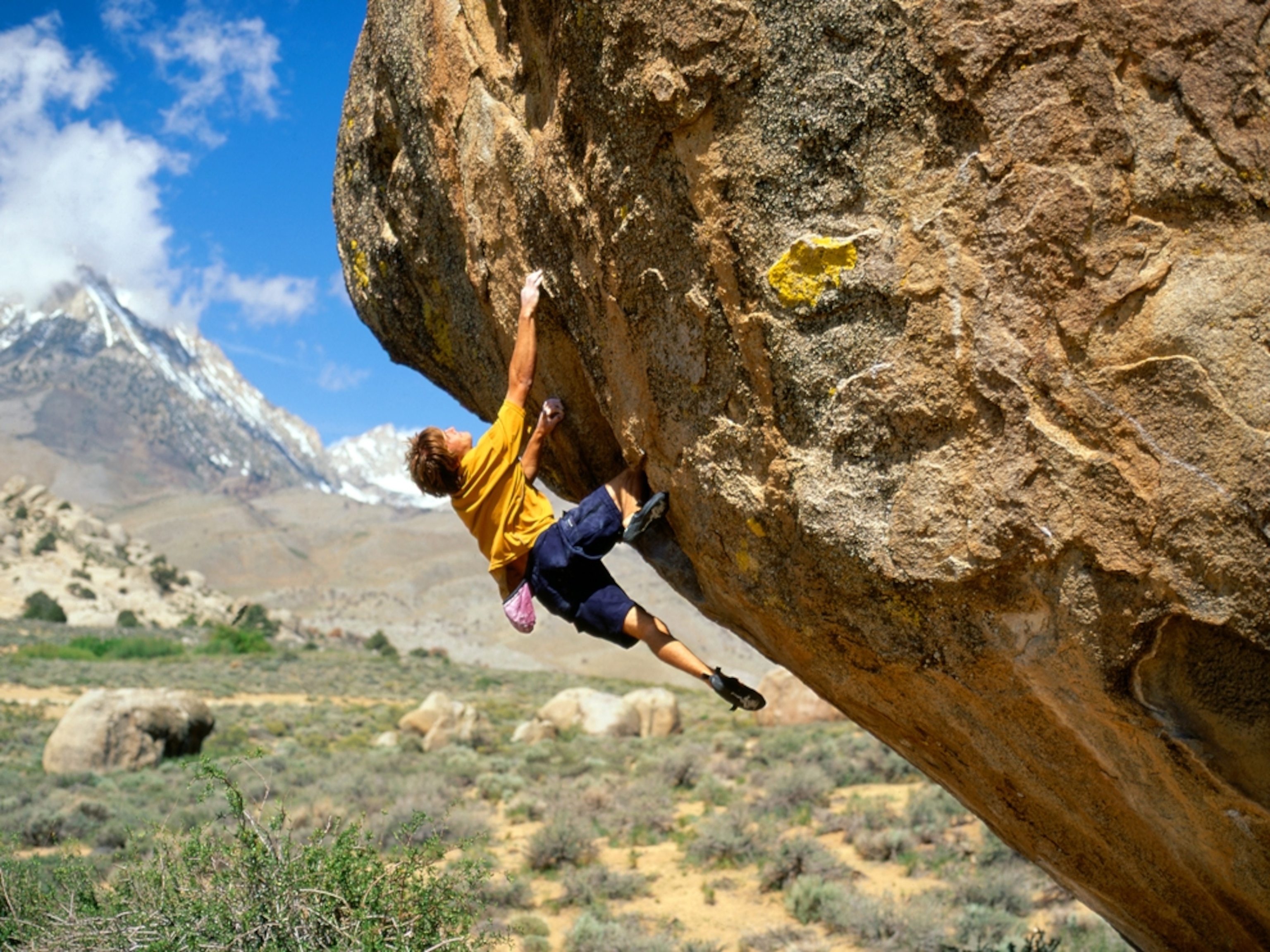 World-class rock climber Chris Sharma boulders at the Buttermilks near Bishop, California.