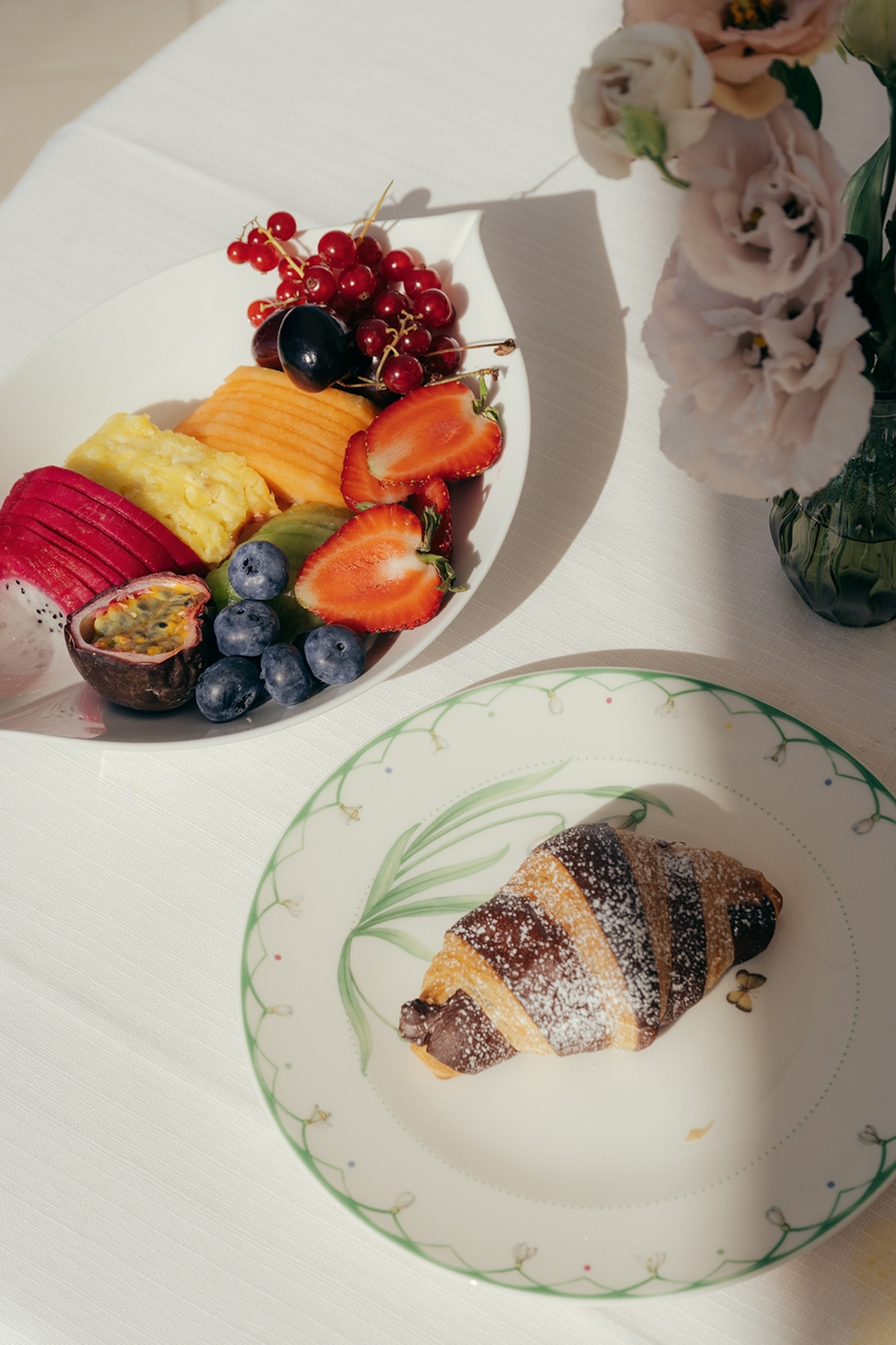 A breakfast spread on a white table.