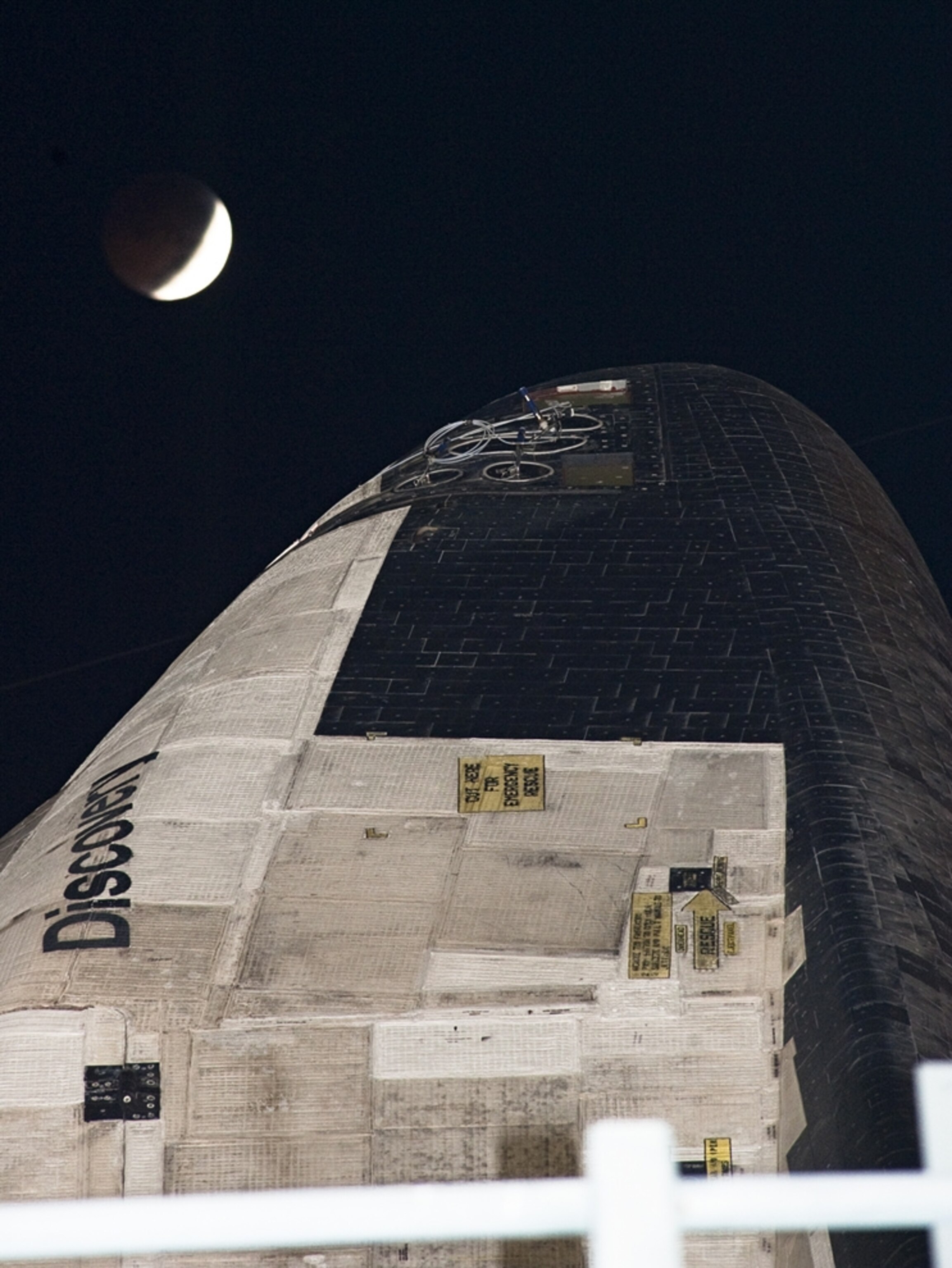 Lunar eclipse in the hours just after December 20th, 2010, over a space shuttle. (NASA picture)