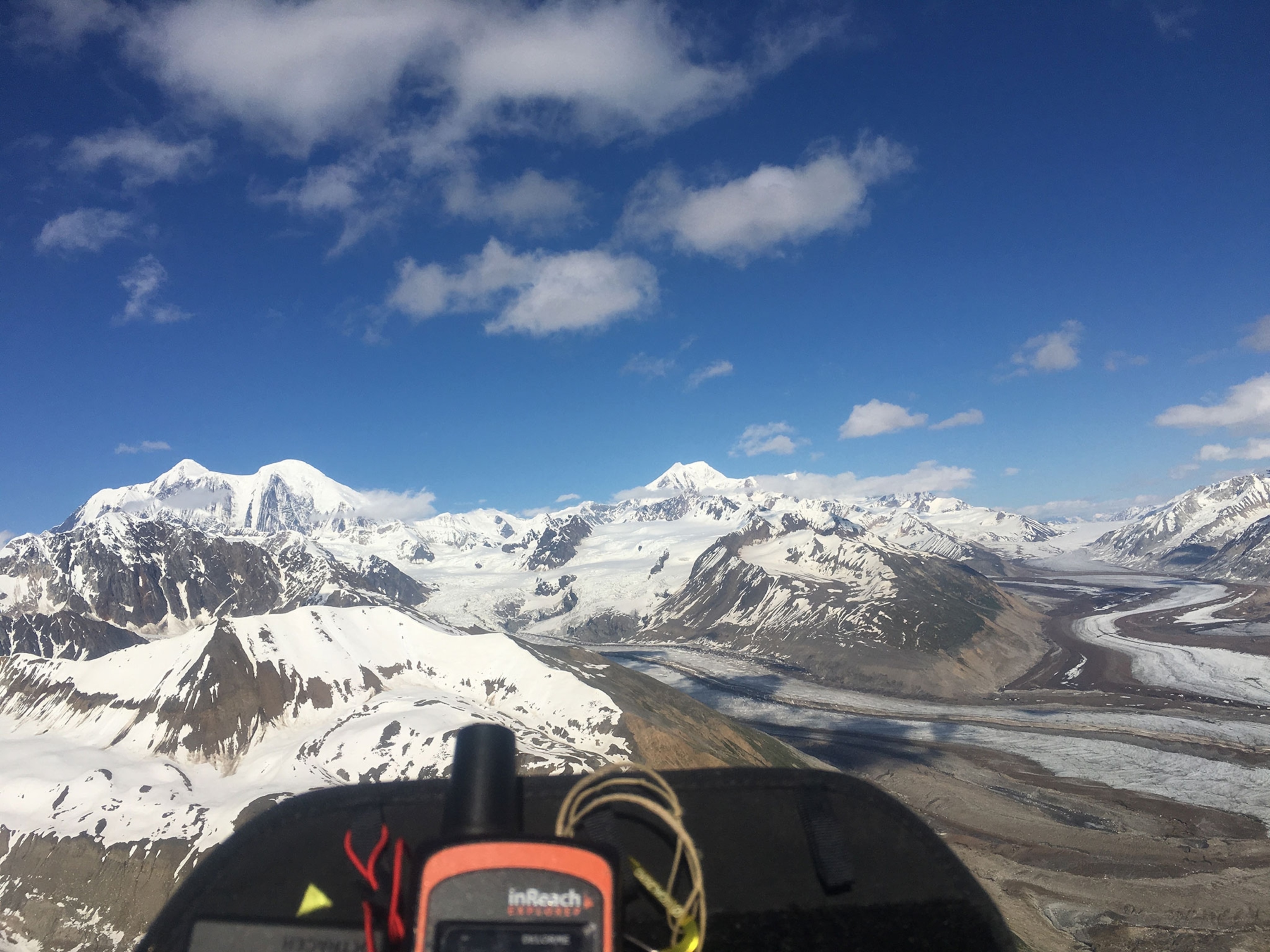 Gavin McClurg flying in his paraglider across the Alaska Traverse
