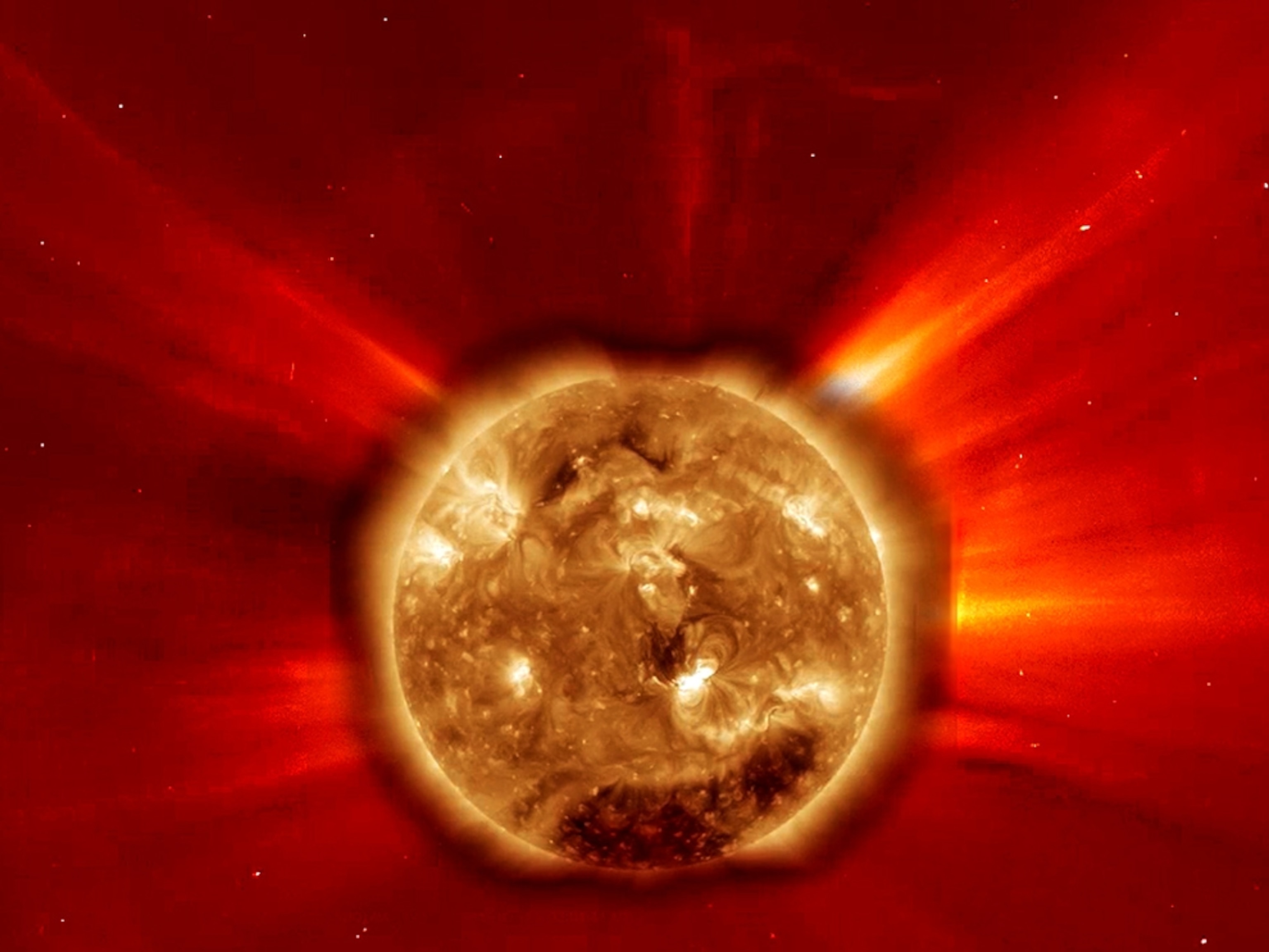 Combined picture of the sun in extreme ultraviolet and the corona halo during a large solar flare.